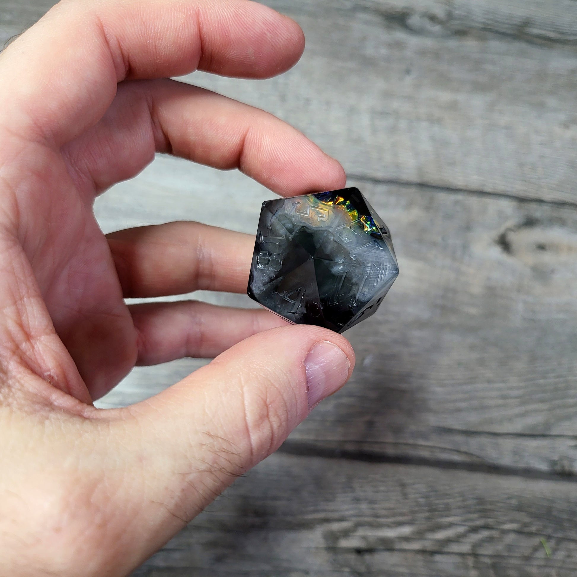 D20 dice in 33 mm format with skull inside for role-playing games for Dungeons and Dragons