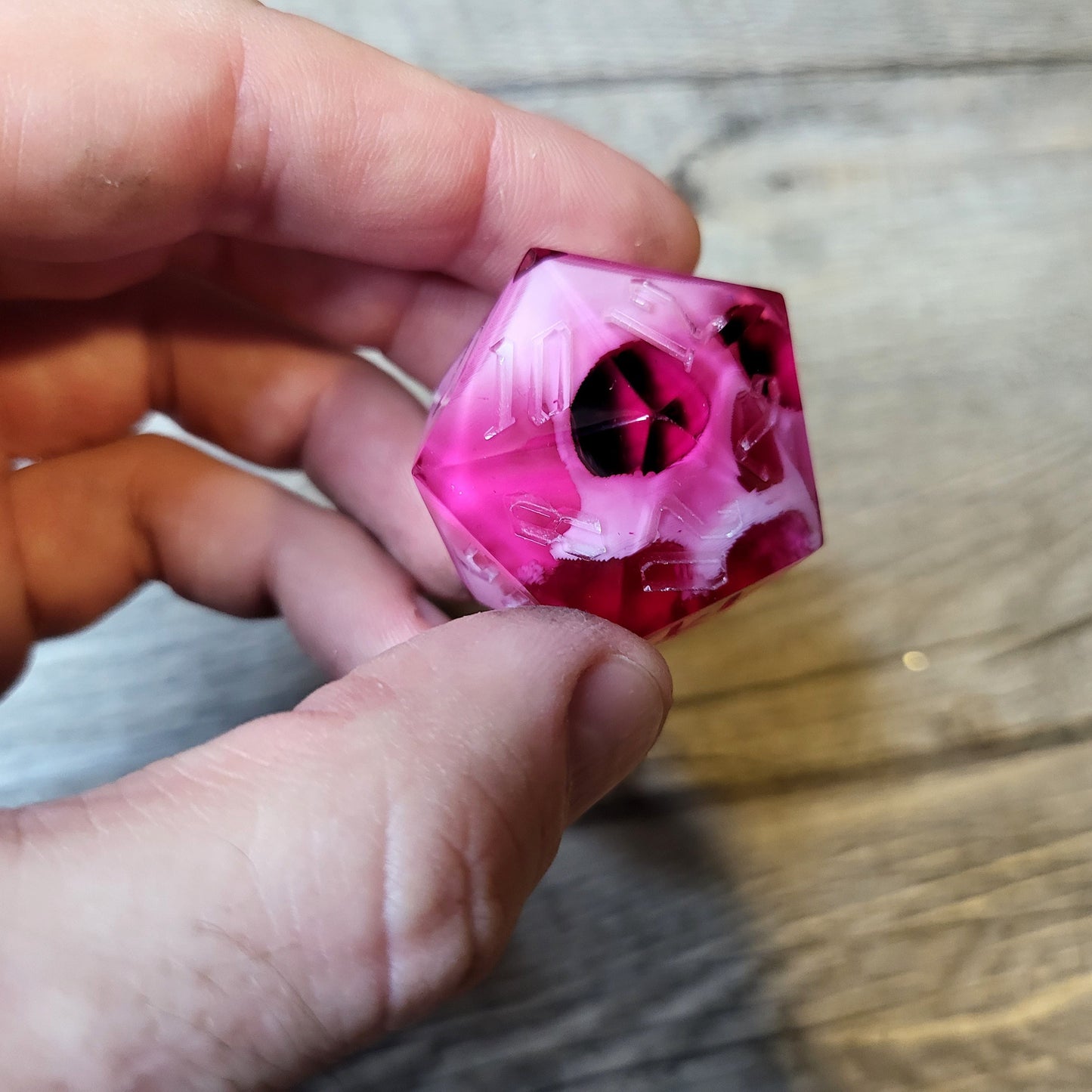 D20 dice in 33 mm format with skull inside for role-playing games for Dungeons and Dragons