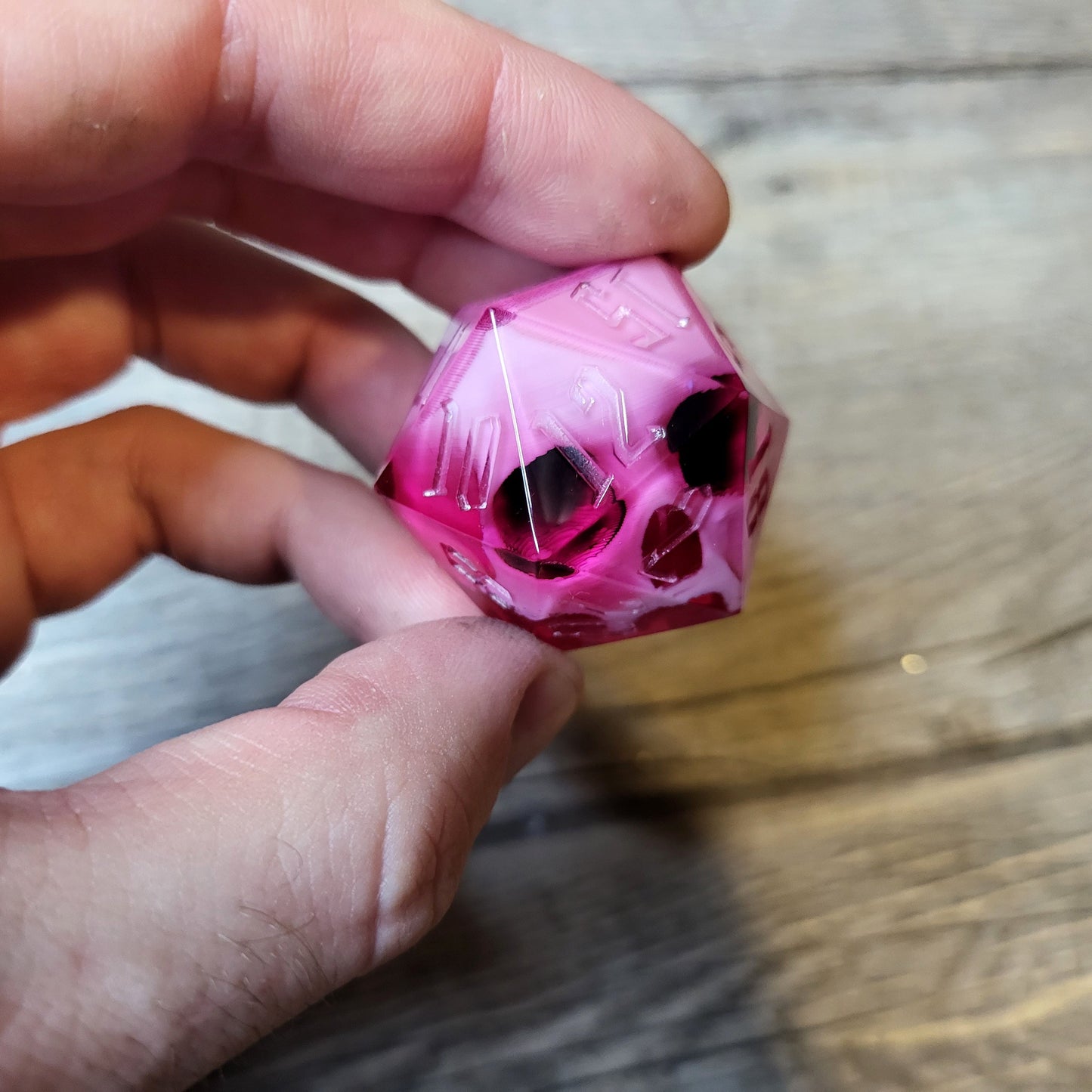 D20 dice in 33 mm format with skull inside for role-playing games for Dungeons and Dragons