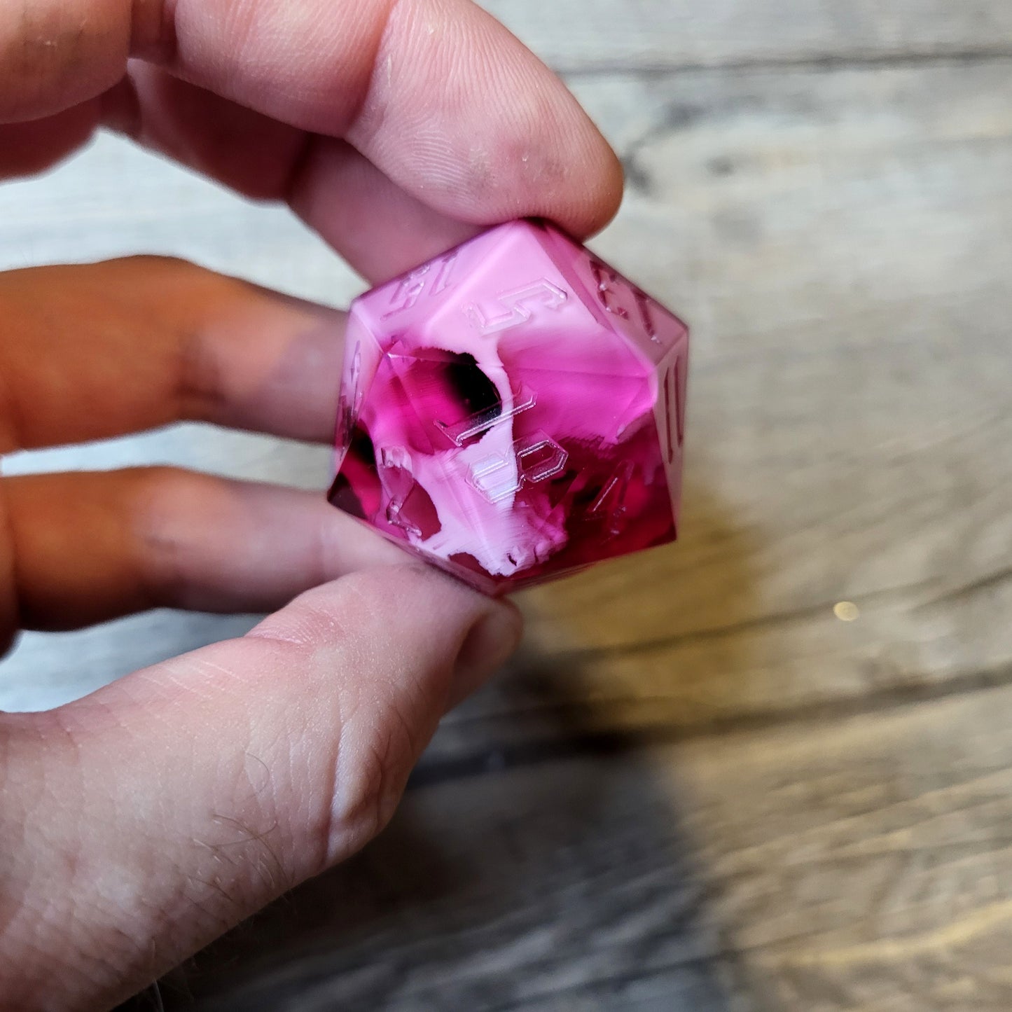 D20 dice in 33 mm format with skull inside for role-playing games for Dungeons and Dragons