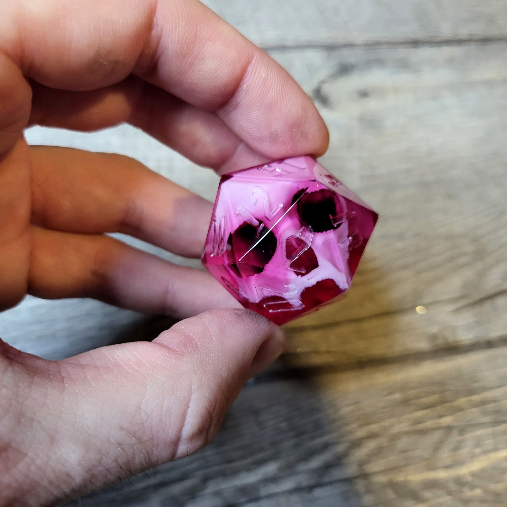 D20 dice in 33 mm format with skull inside for role-playing games for Dungeons and Dragons