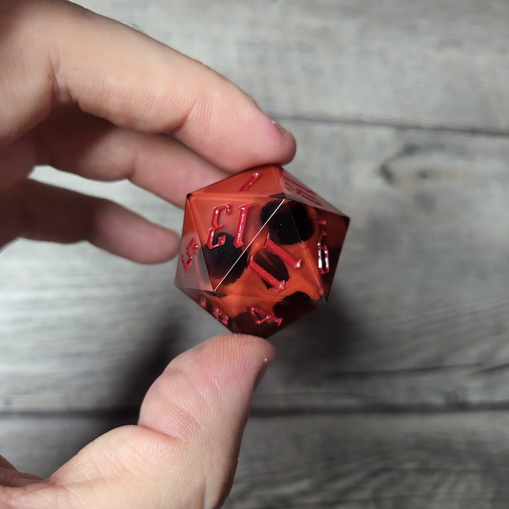 D20 dice in 33 mm format with skull inside for role-playing games for Dungeons and Dragons