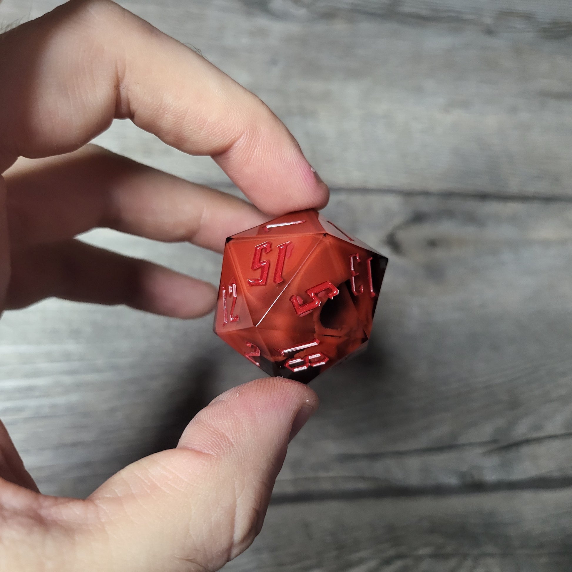 D20 dice in 33 mm format with skull inside for role-playing games for Dungeons and Dragons