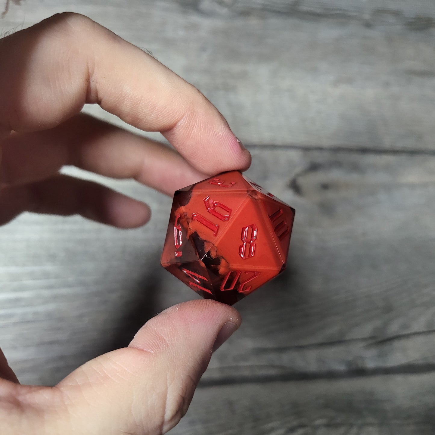D20 dice in 33 mm format with skull inside for role-playing games for Dungeons and Dragons