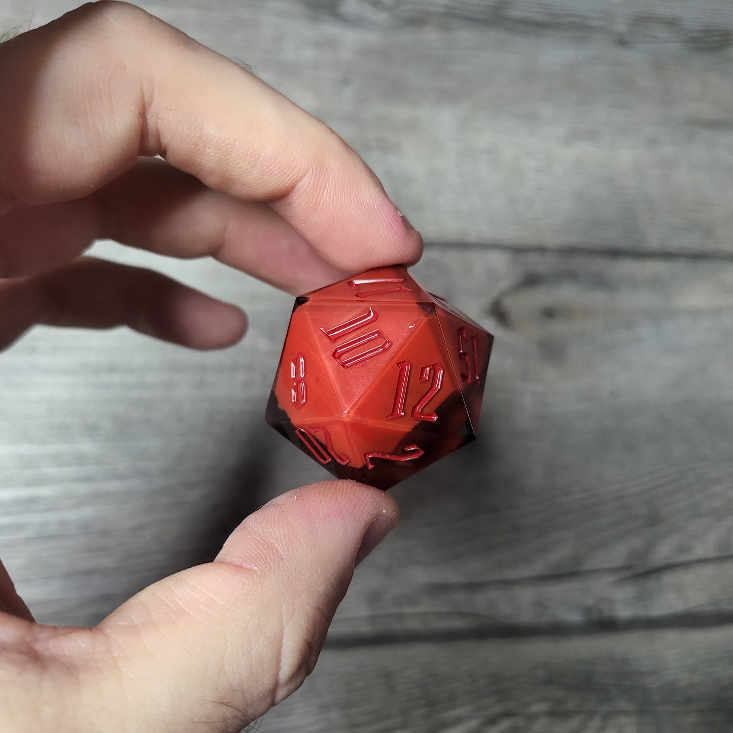 D20 dice in 33 mm format with skull inside for role-playing games for Dungeons and Dragons