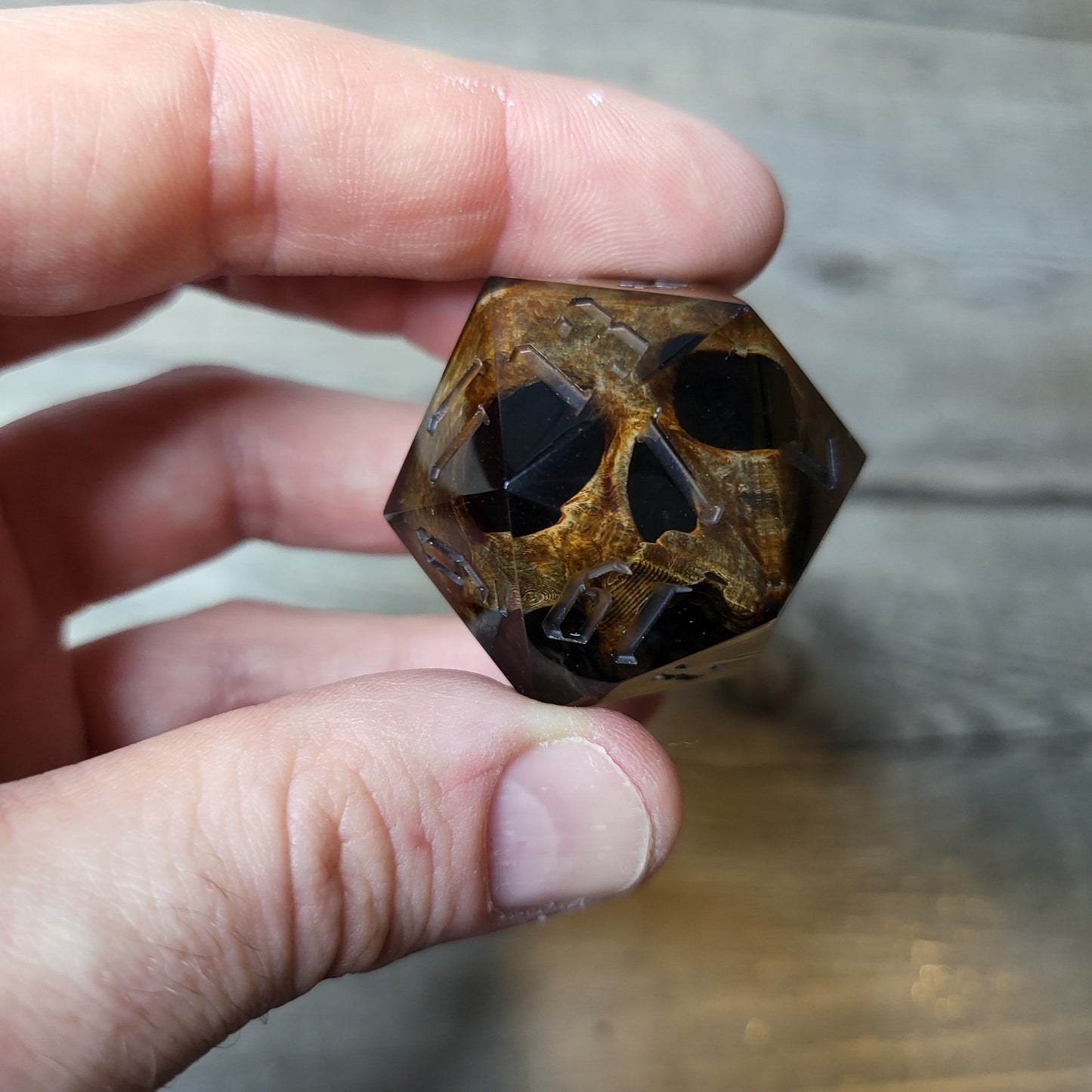 D20 dice in 33 mm format with skull inside for role-playing games for Dungeons and Dragons