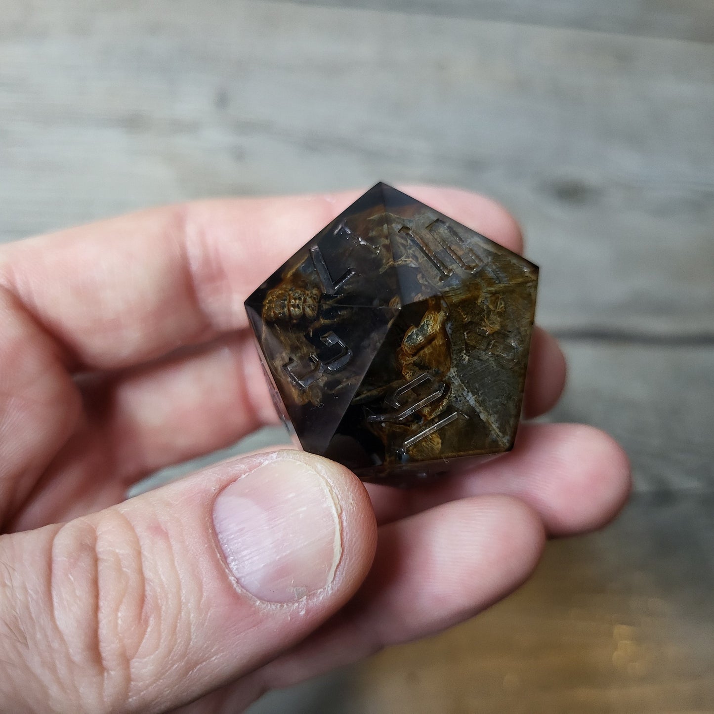 D20 dice in 33 mm format with skull inside for role-playing games for Dungeons and Dragons