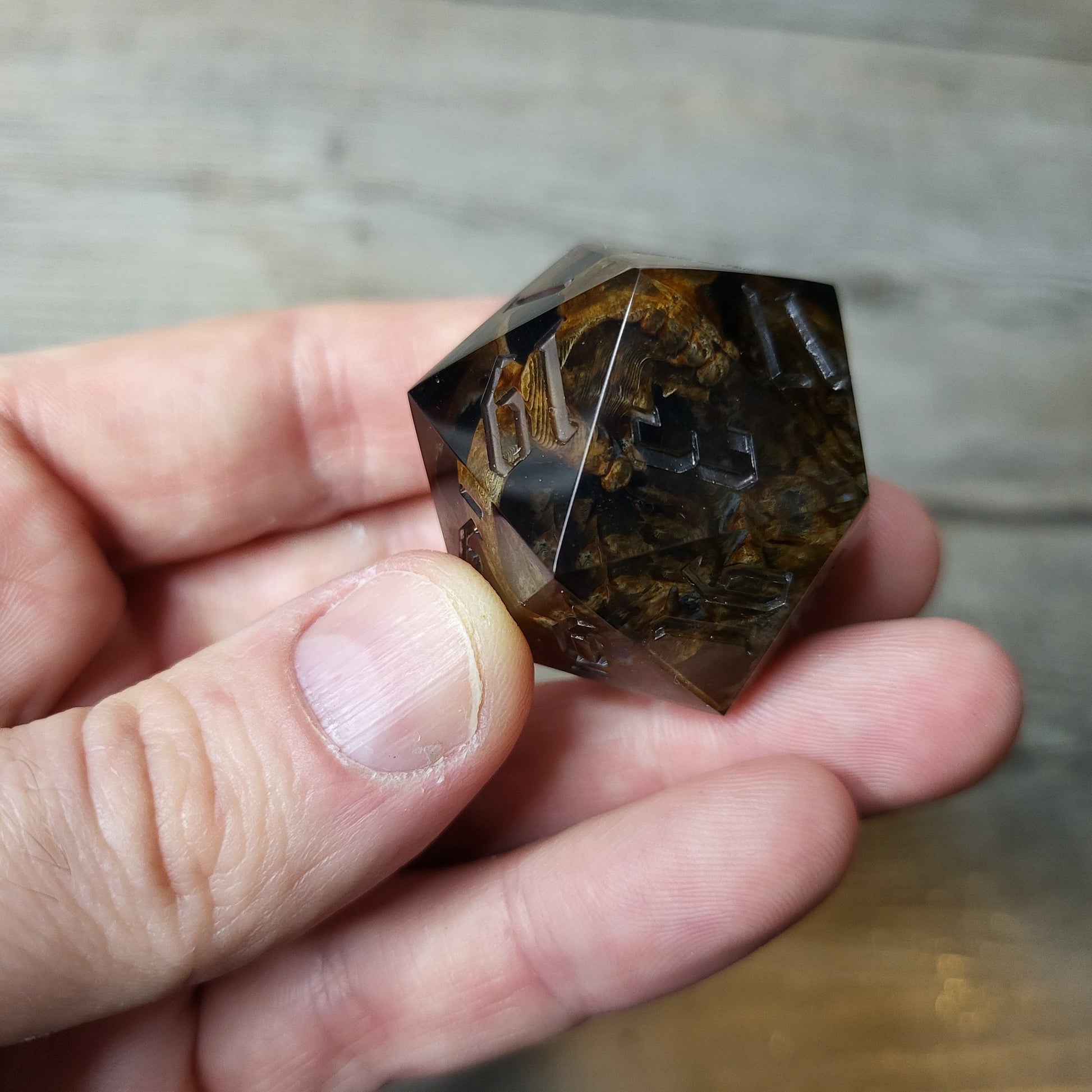 D20 dice in 33 mm format with skull inside for role-playing games for Dungeons and Dragons