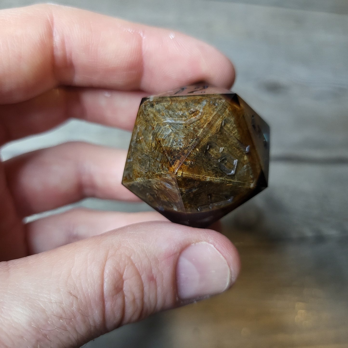 D20 dice in 33 mm format with skull inside for role-playing games for Dungeons and Dragons