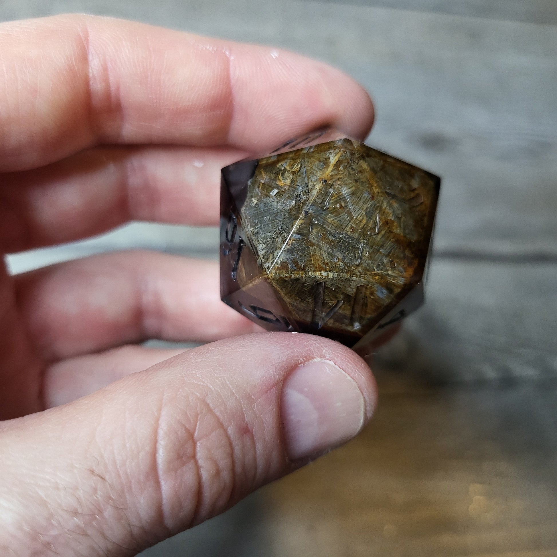 D20 dice in 33 mm format with skull inside for role-playing games for Dungeons and Dragons