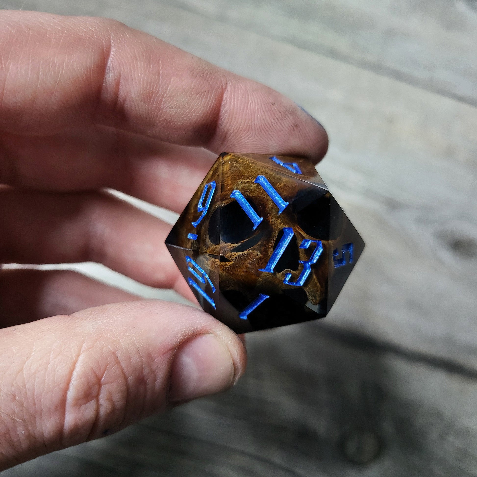 D20 dice in 33 mm format with skull inside for role-playing games for Dungeons and Dragons