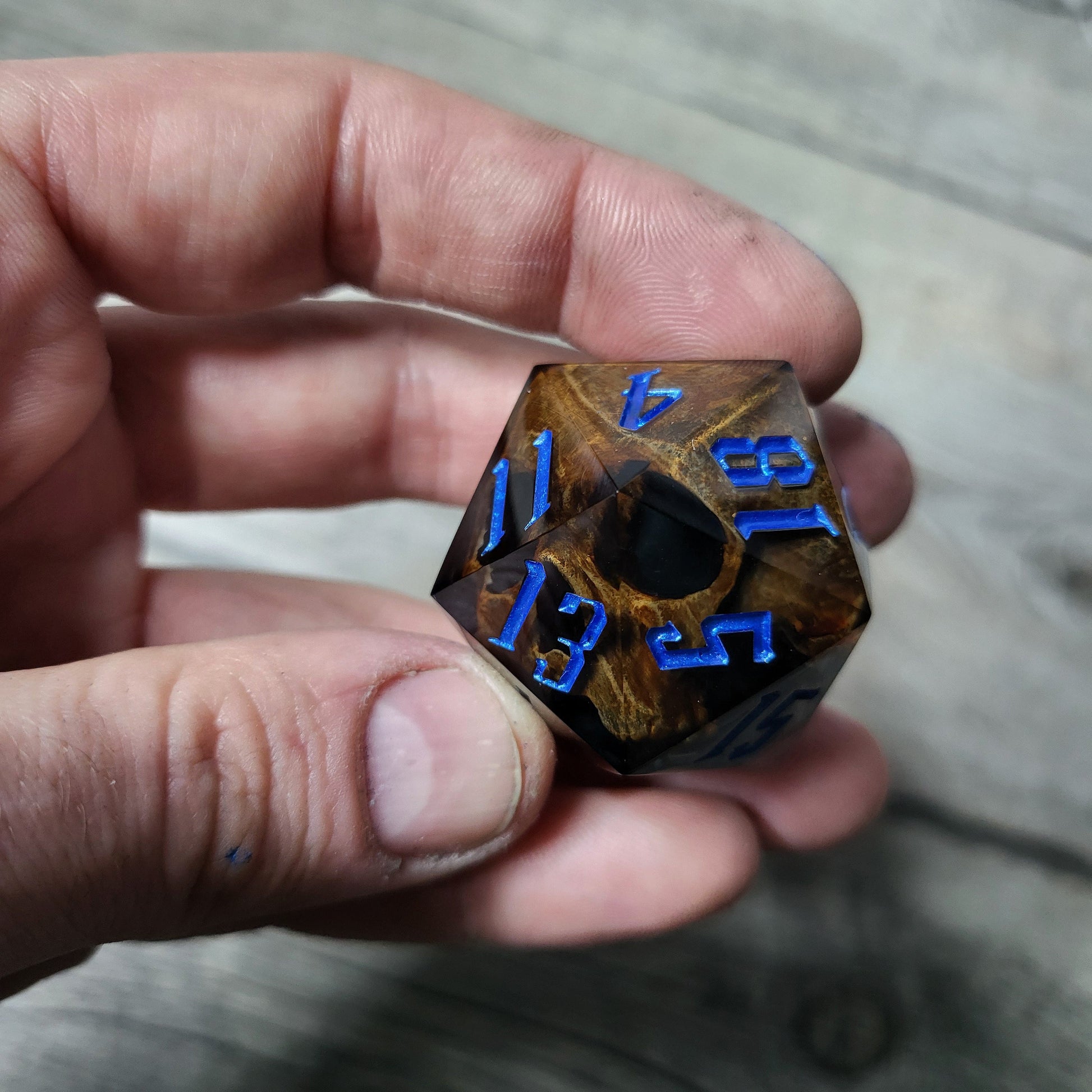D20 dice in 33 mm format with skull inside for role-playing games for Dungeons and Dragons