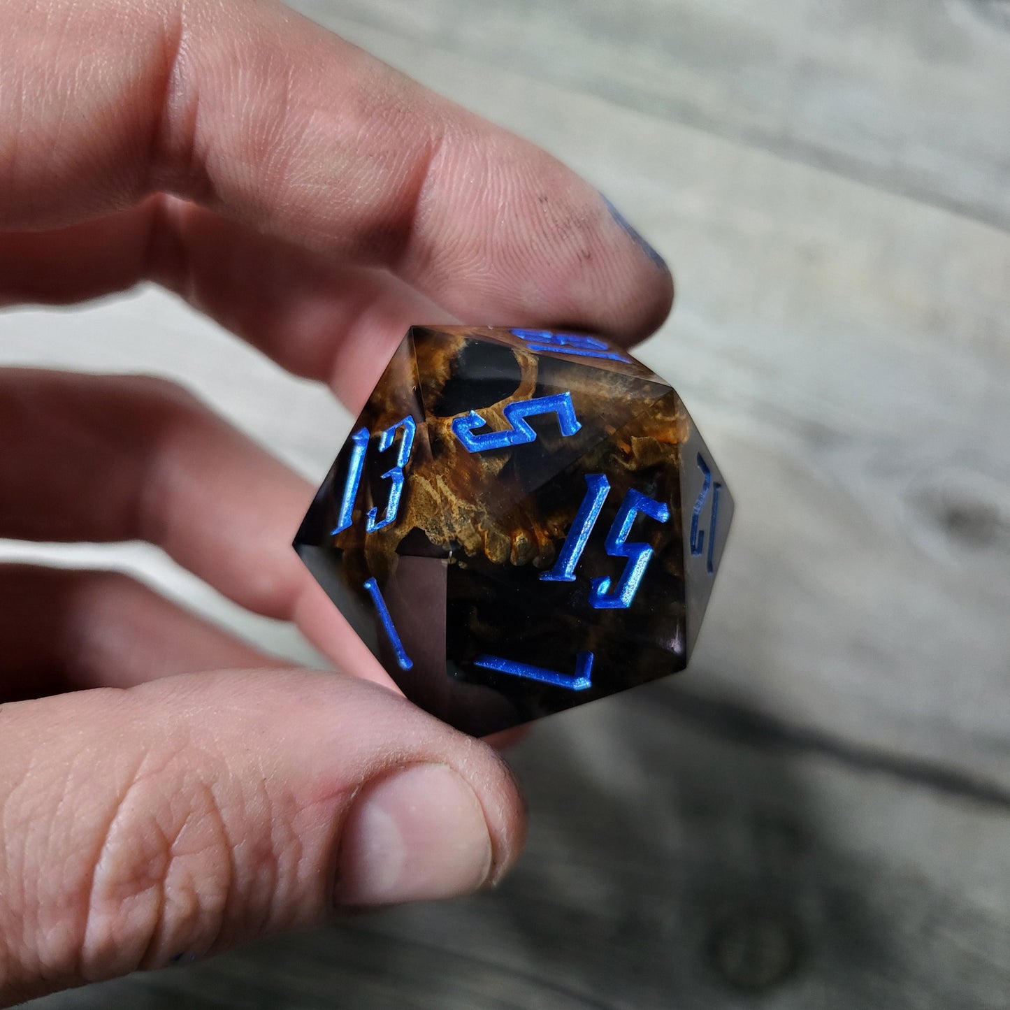 D20 dice in 33 mm format with skull inside for role-playing games for Dungeons and Dragons