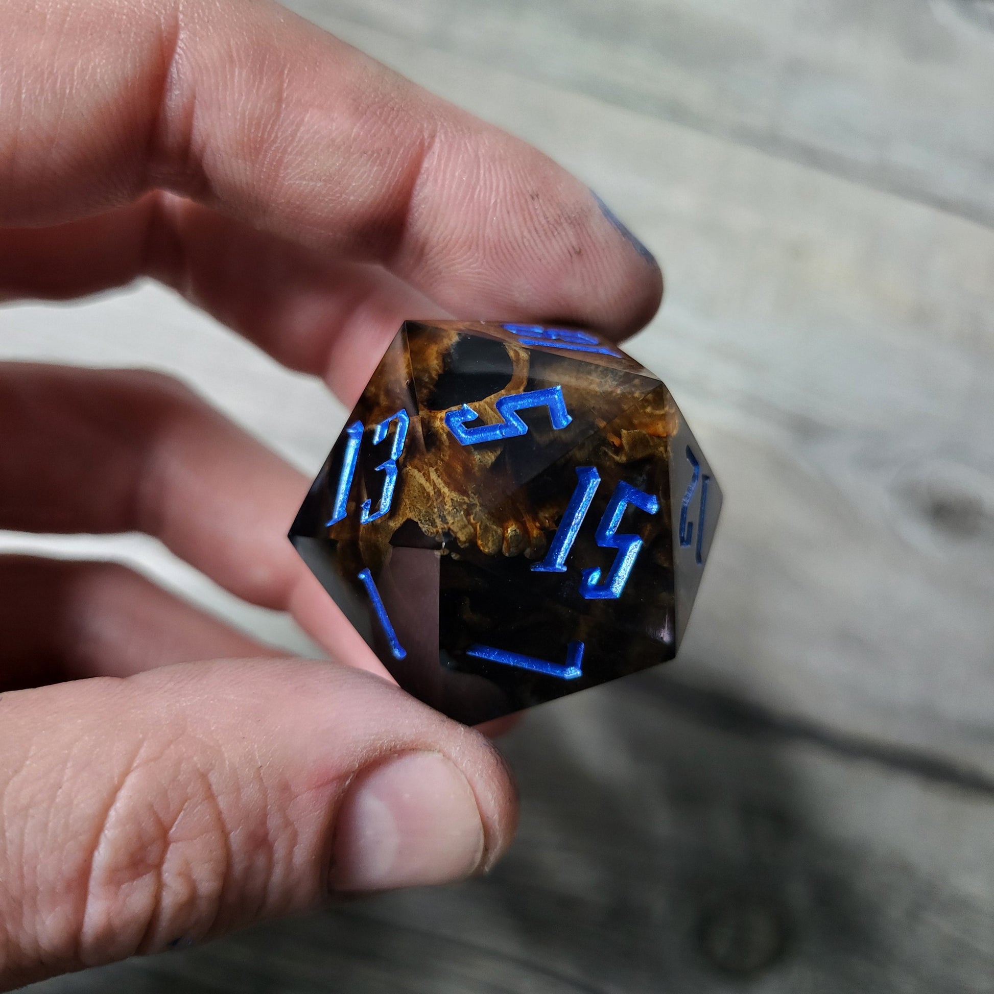 D20 dice in 33 mm format with skull inside for role-playing games for Dungeons and Dragons