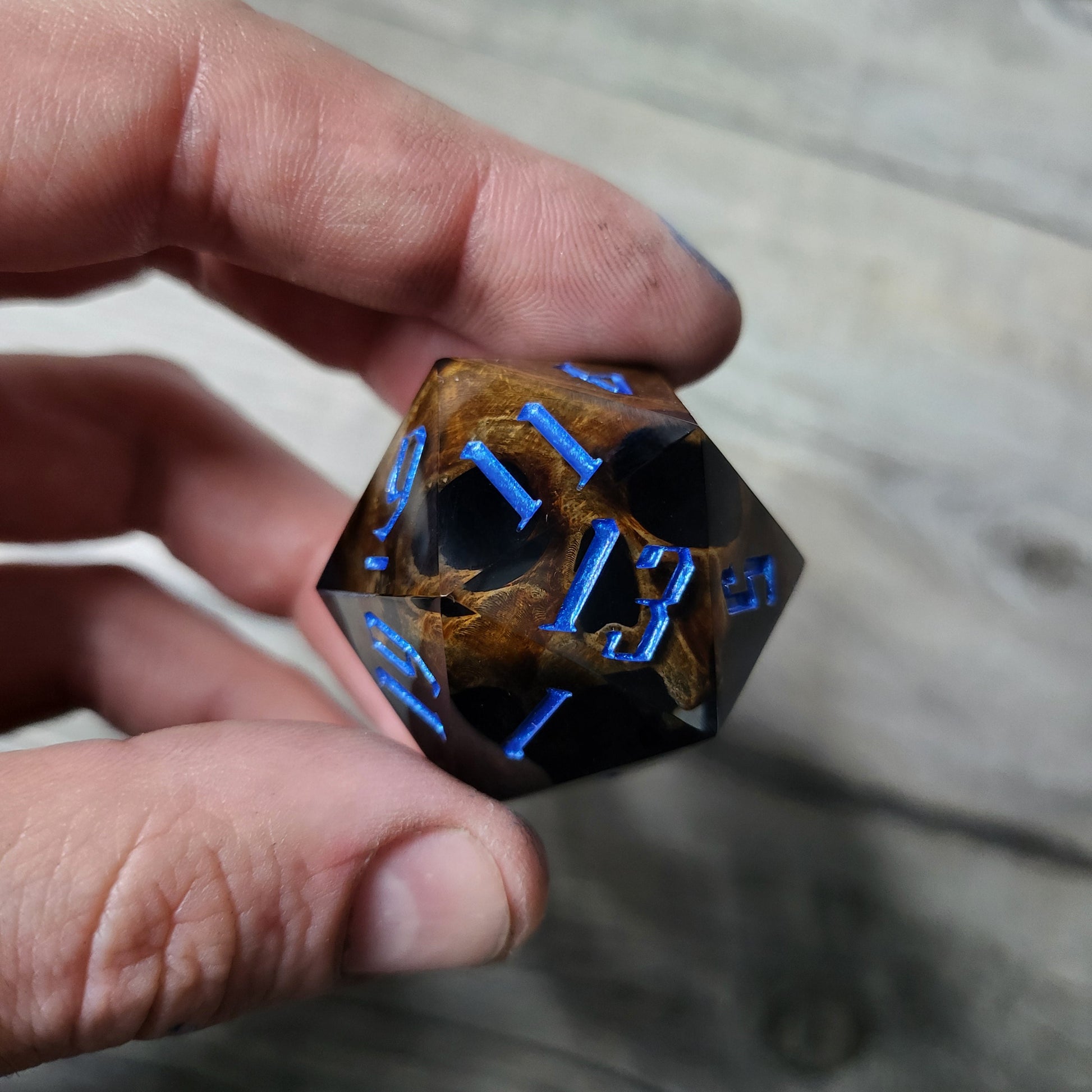 D20 dice in 33 mm format with skull inside for role-playing games for Dungeons and Dragons