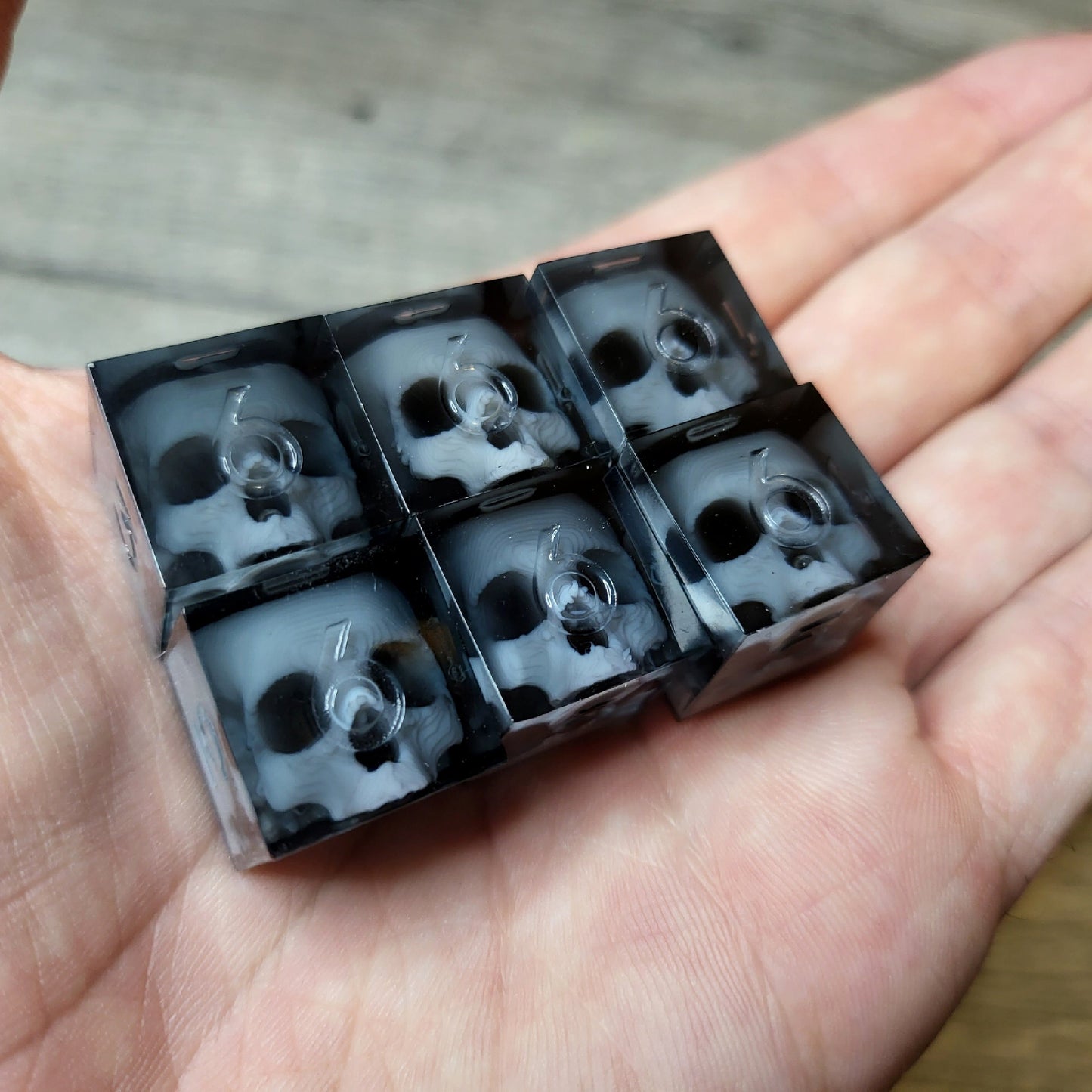 Dice set in D6 format with skull inside for role-playing games for Dungeons and Dragons