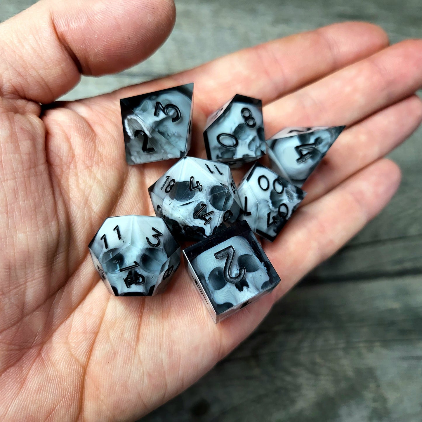 Dice set with 7 pieces with skull inside for role-playing games for Dungeons and Dragons