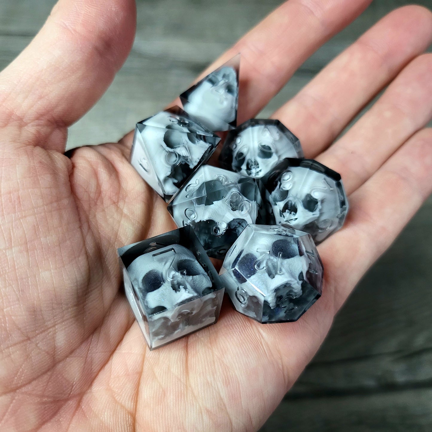 Dice set with 7 pieces with skull inside for role-playing games for Dungeons and Dragons