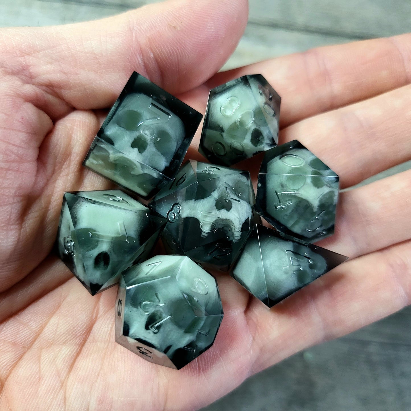 Dice set with 7 pieces with skull inside for role-playing games for Dungeons and Dragons