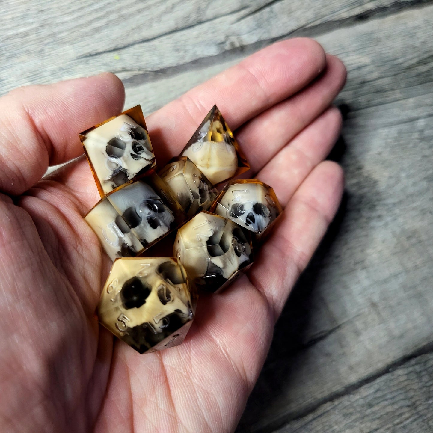 Dice set with 7 pieces with skull inside for role-playing games for Dungeons and Dragons