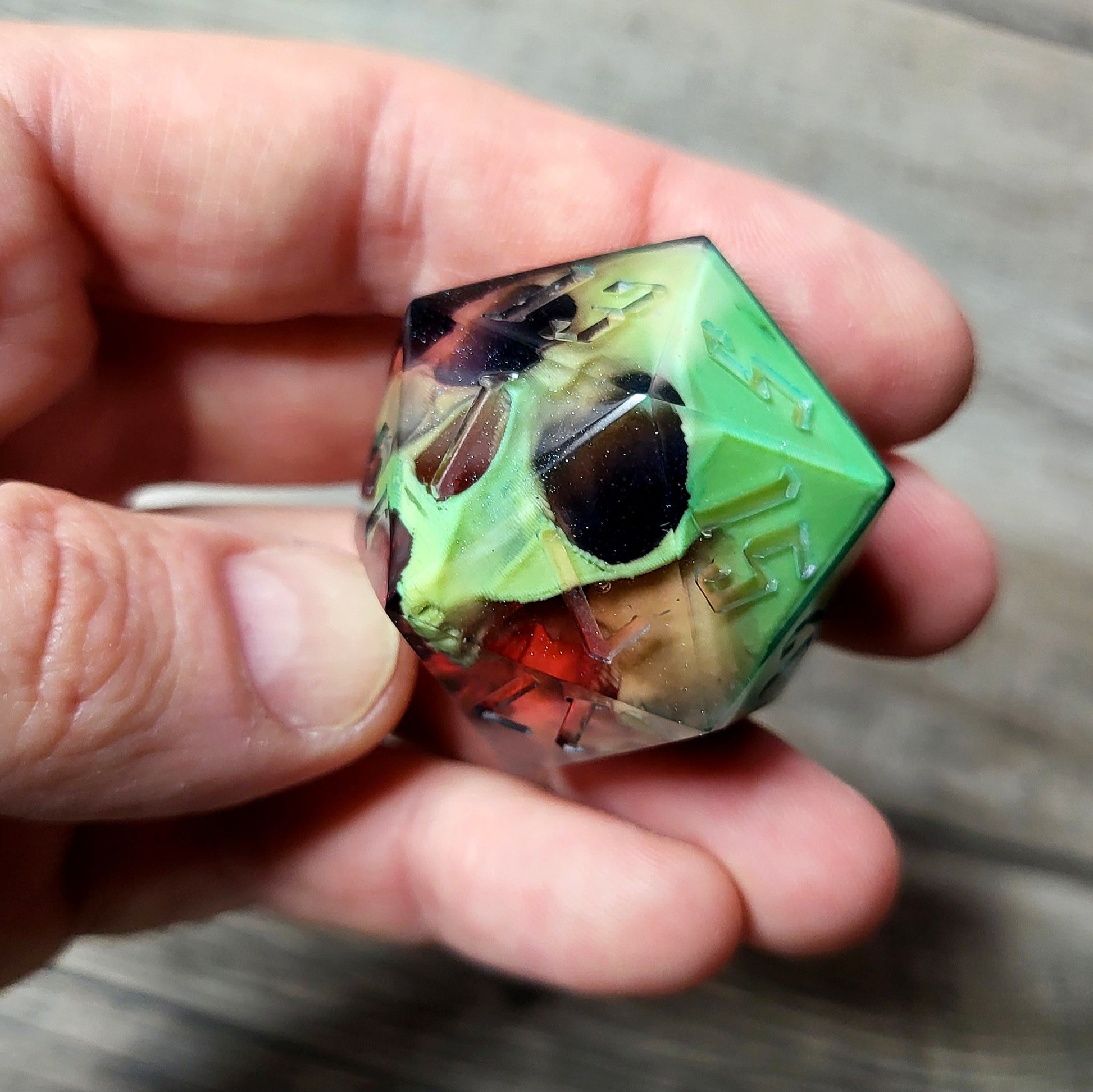 D20 dice in 33 mm format with skull inside for role-playing games for Dungeons and Dragons