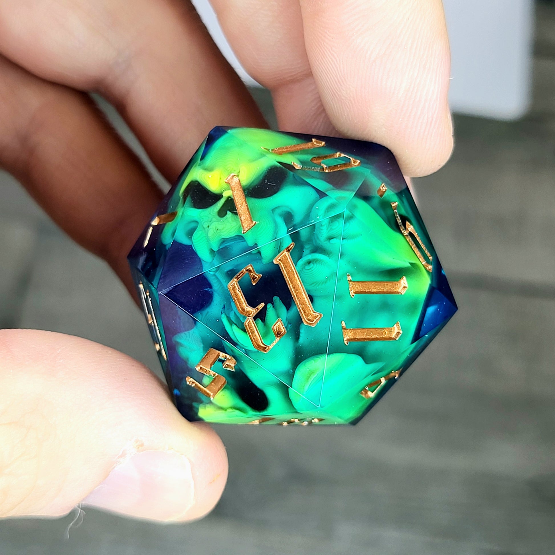 D20 dice in 33 mm format with skull inside for role-playing games for Dungeons and Dragons