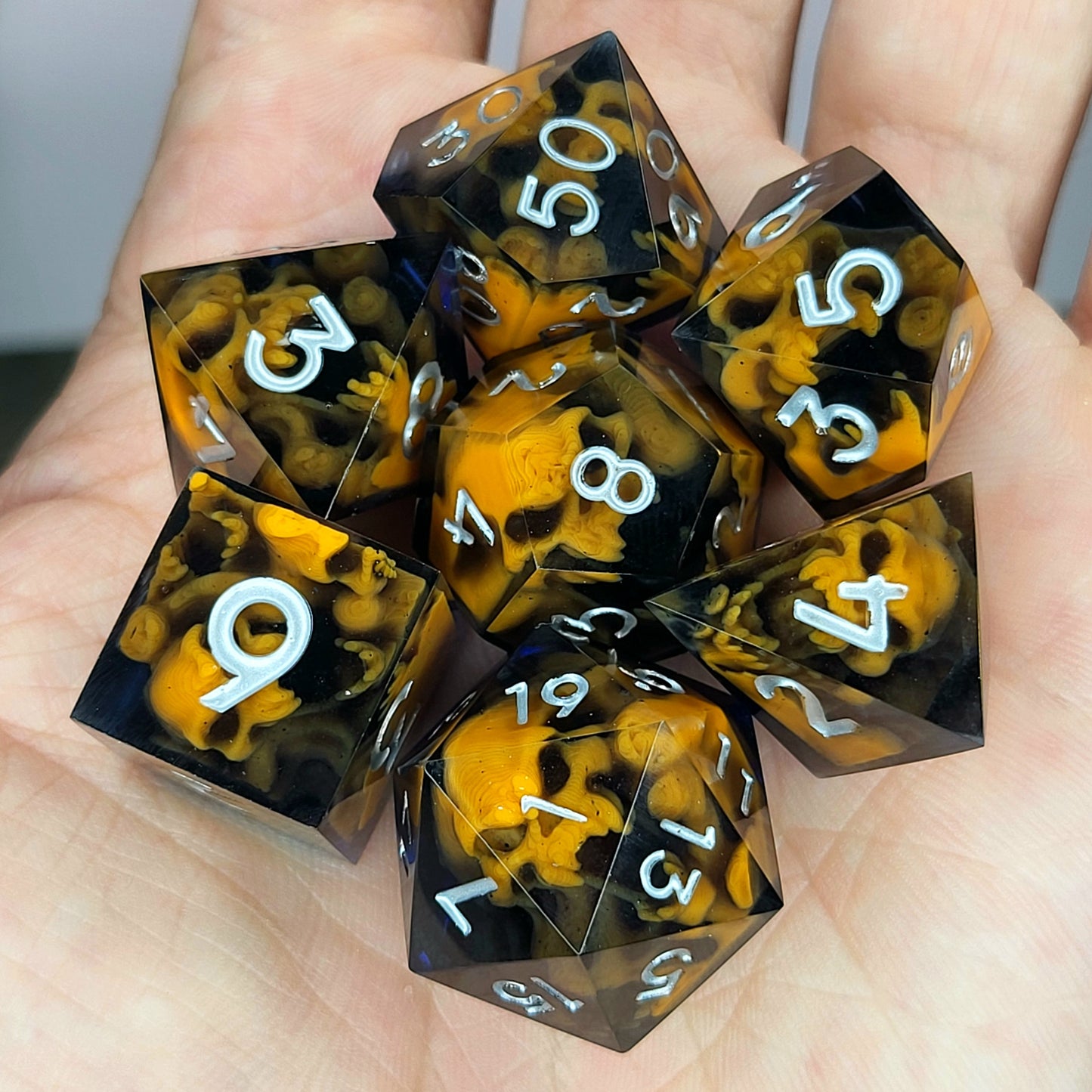 Dice set with orange spirit inside and black resin for play dnd , dungeons and dragons