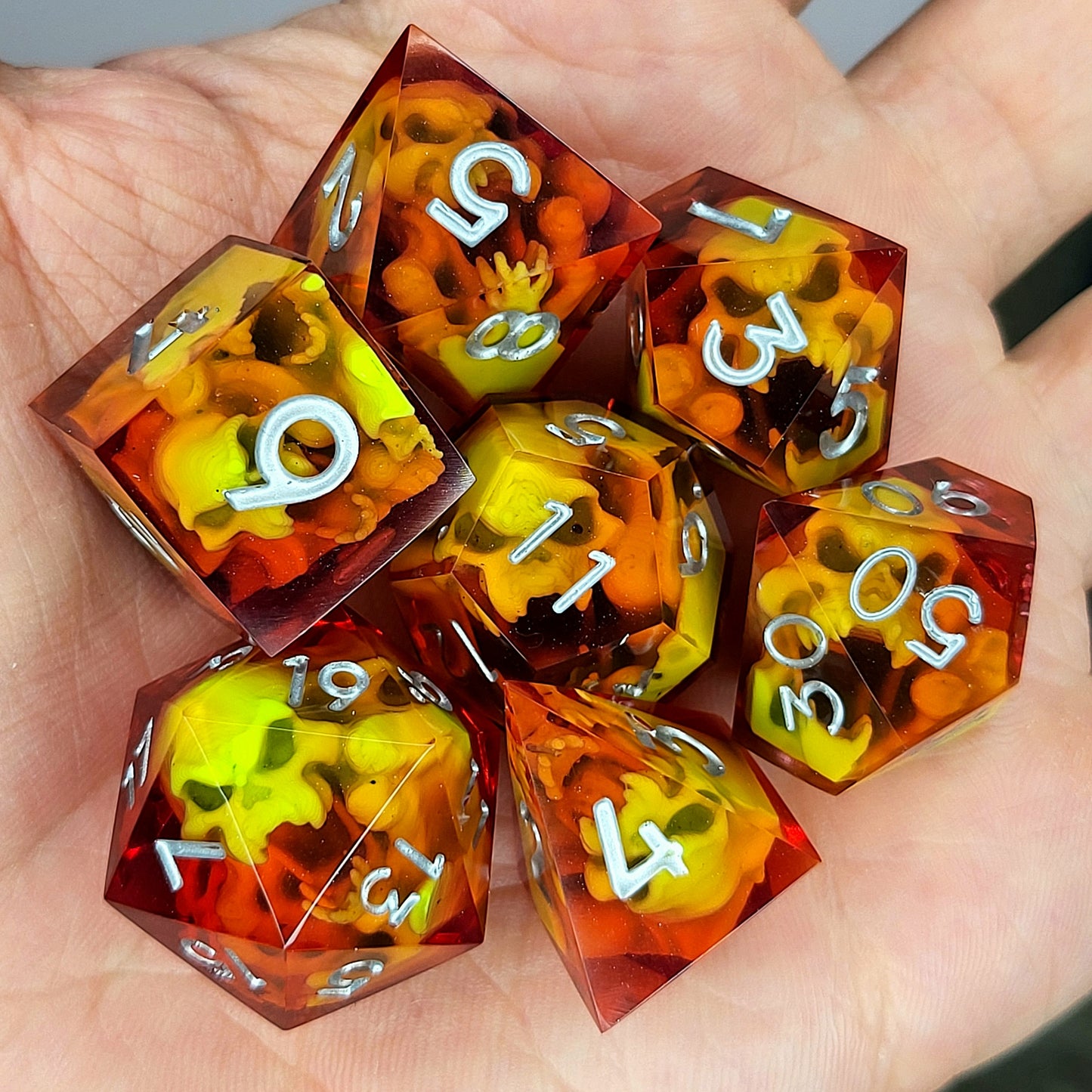 Dice set with green spirit inside and silver numbers for play dnd , dungeons and dragons