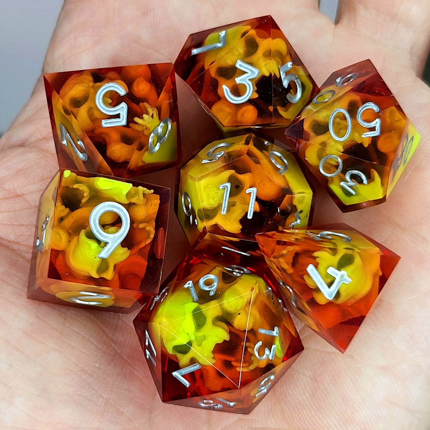 Dice set with green spirit inside and silver numbers for play dnd , dungeons and dragons