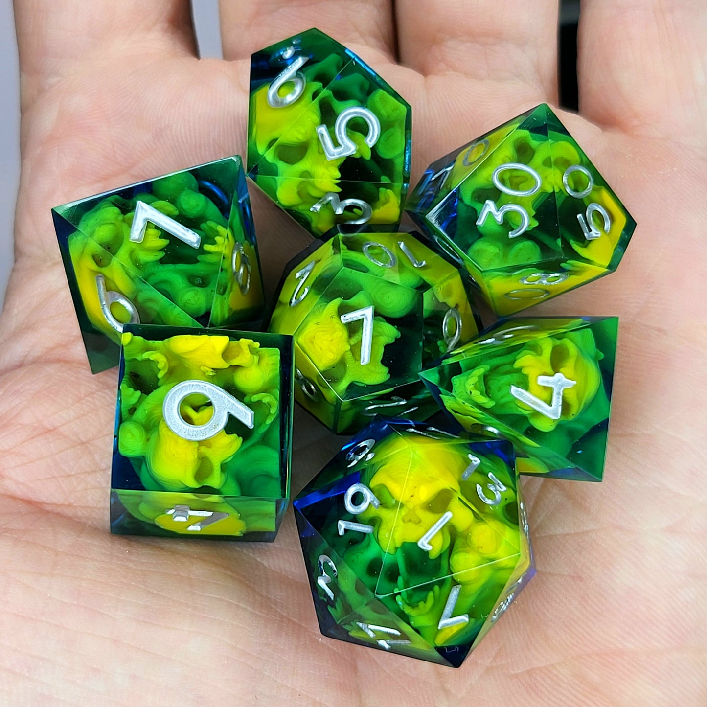 Dice set with yellow spirit inside and silver numbers for play dnd , dungeons and dragons