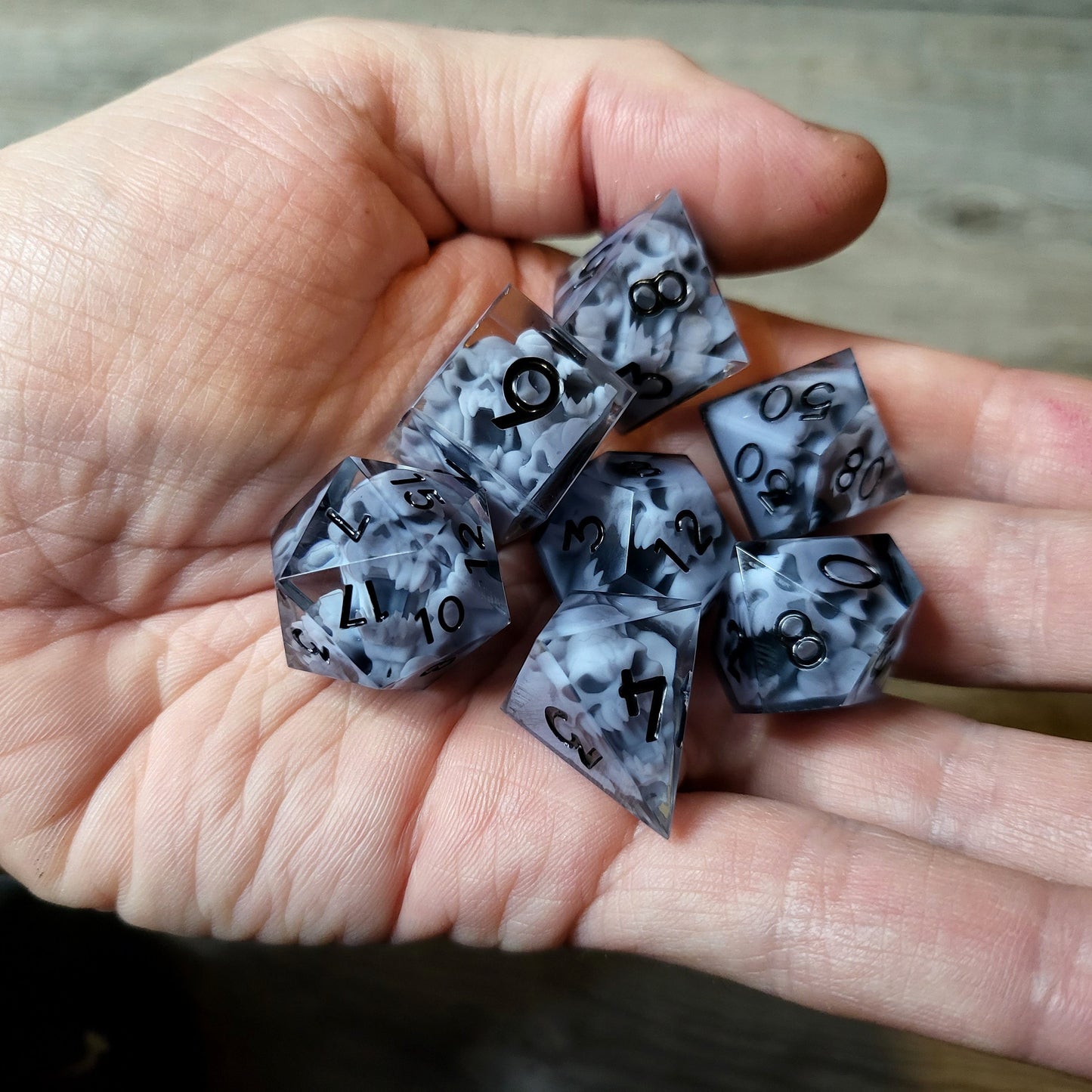 Dice set with 7 pieces with skull inside in spirit theme for role-playing games for Dungeons and Dragons