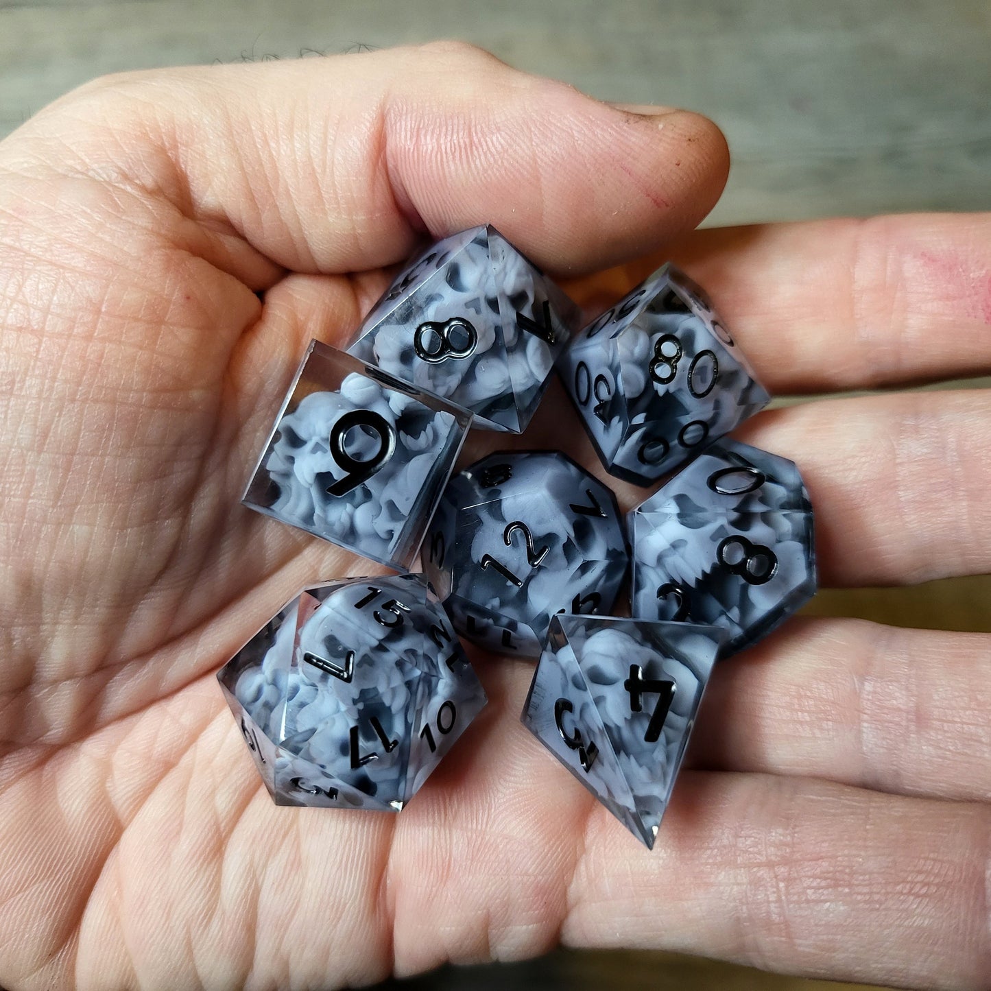 Dice set with 7 pieces with skull inside in spirit theme for role-playing games for Dungeons and Dragons