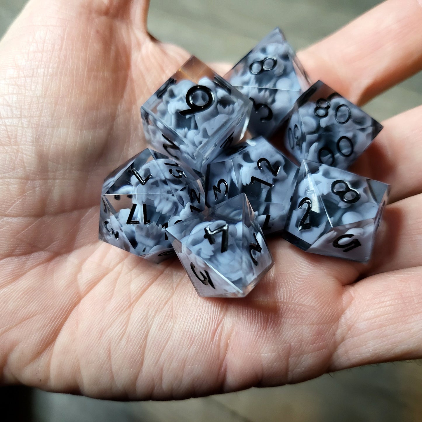 Dice set with 7 pieces with skull inside in spirit theme for role-playing games for Dungeons and Dragons