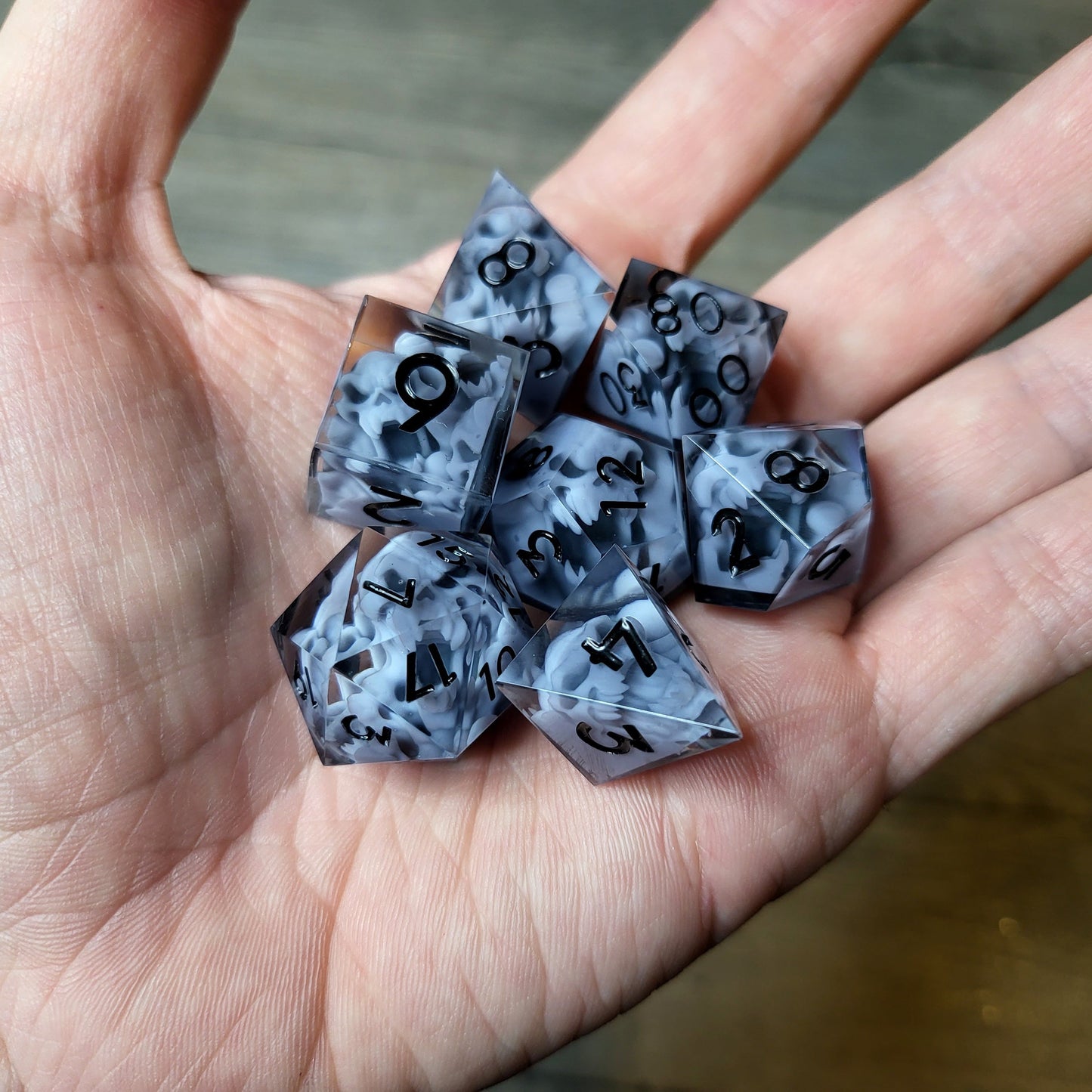 Dice set with 7 pieces with skull inside in spirit theme for role-playing games for Dungeons and Dragons