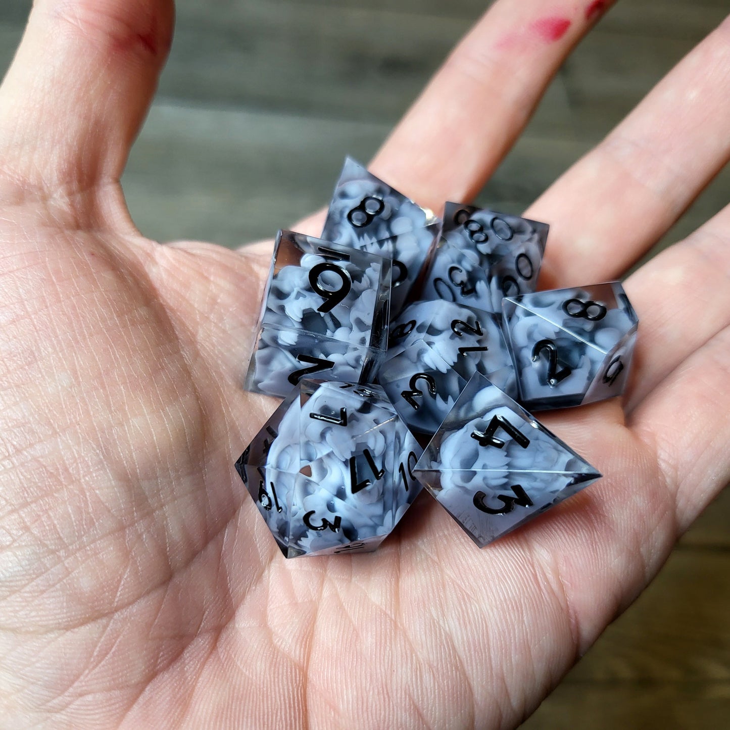 Dice set with 7 pieces with skull inside in spirit theme for role-playing games for Dungeons and Dragons