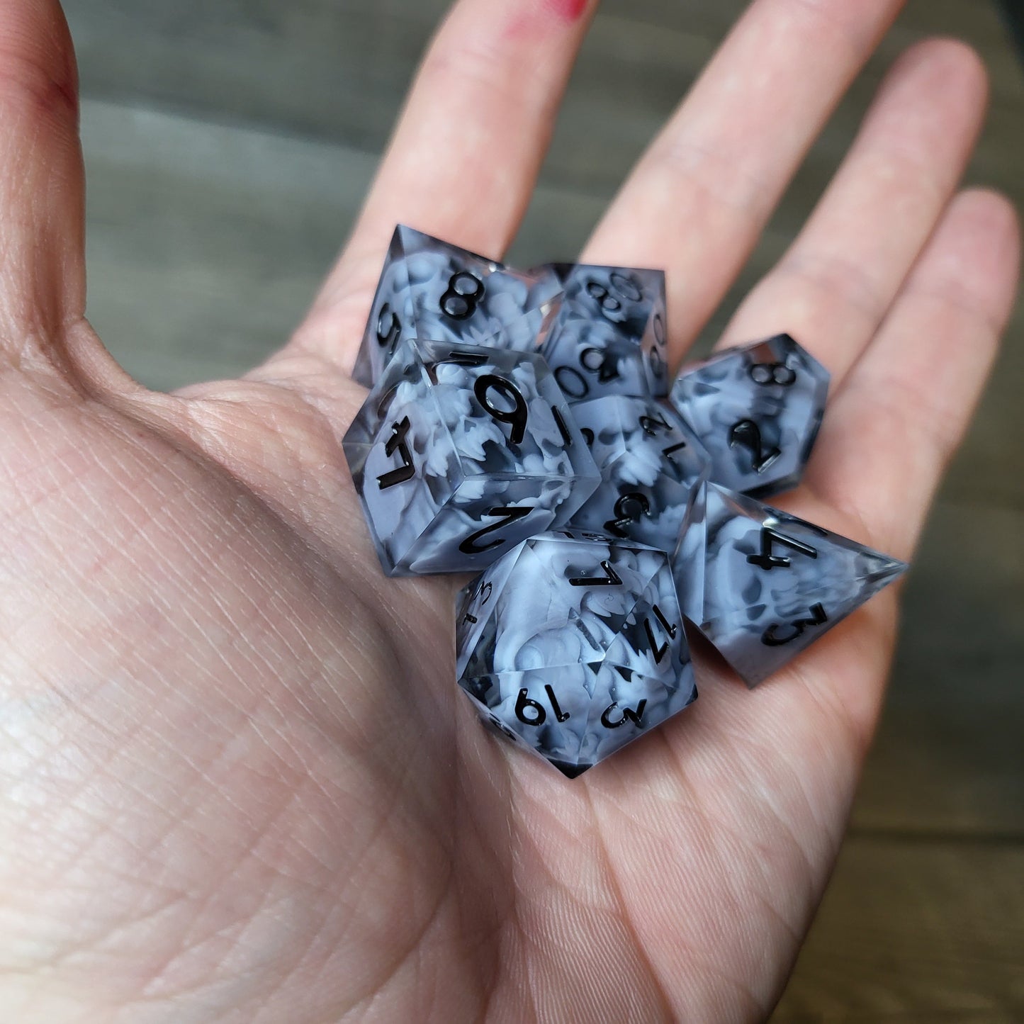 Dice set with 7 pieces with skull inside in spirit theme for role-playing games for Dungeons and Dragons