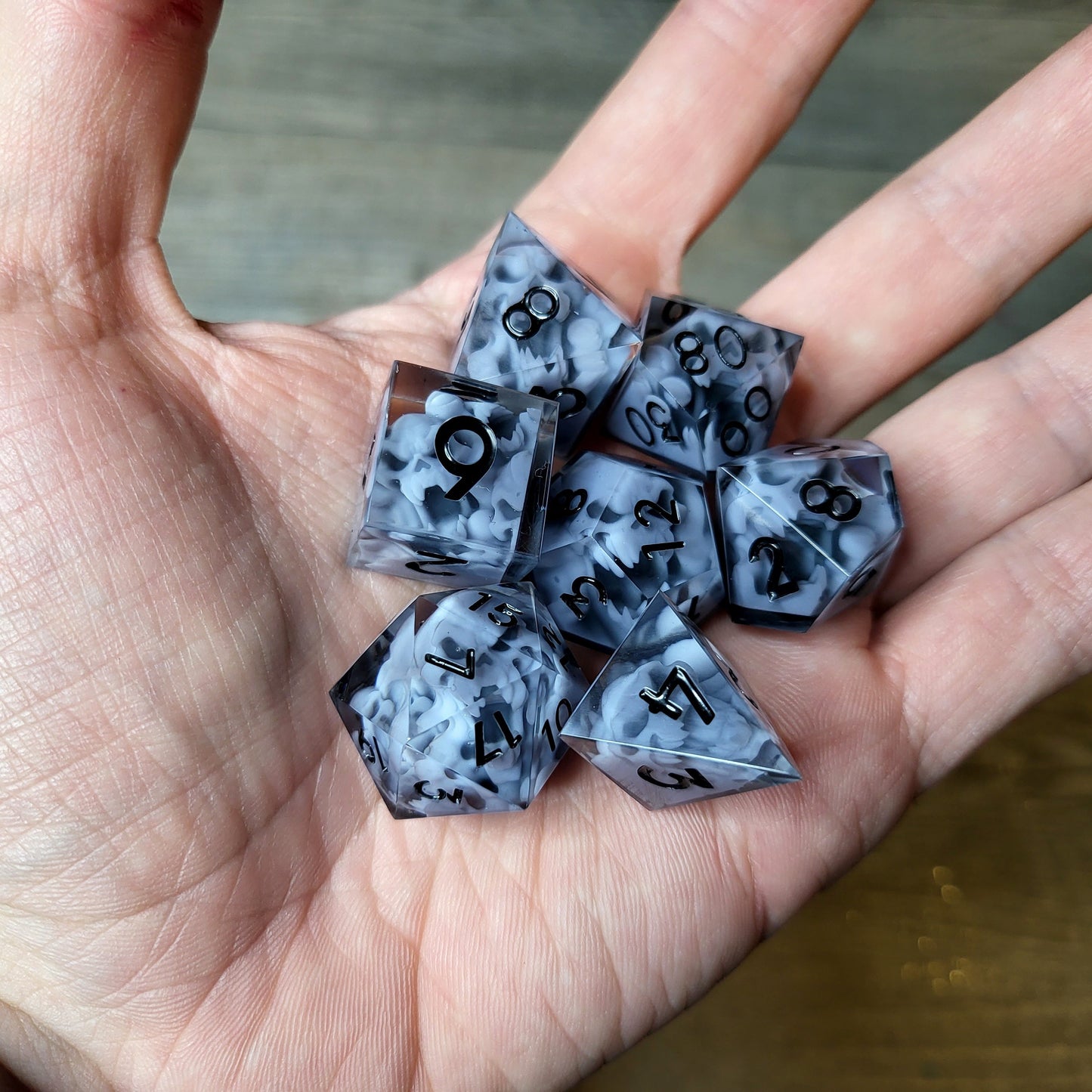 Dice set with 7 pieces with skull inside in spirit theme for role-playing games for Dungeons and Dragons