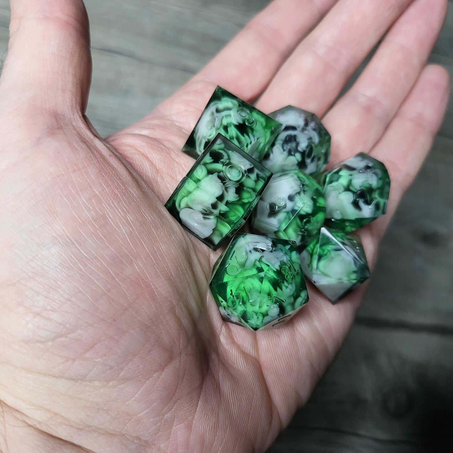 Dice set with 7 pieces with skull inside in spirit theme for role-playing games for Dungeons and Dragons