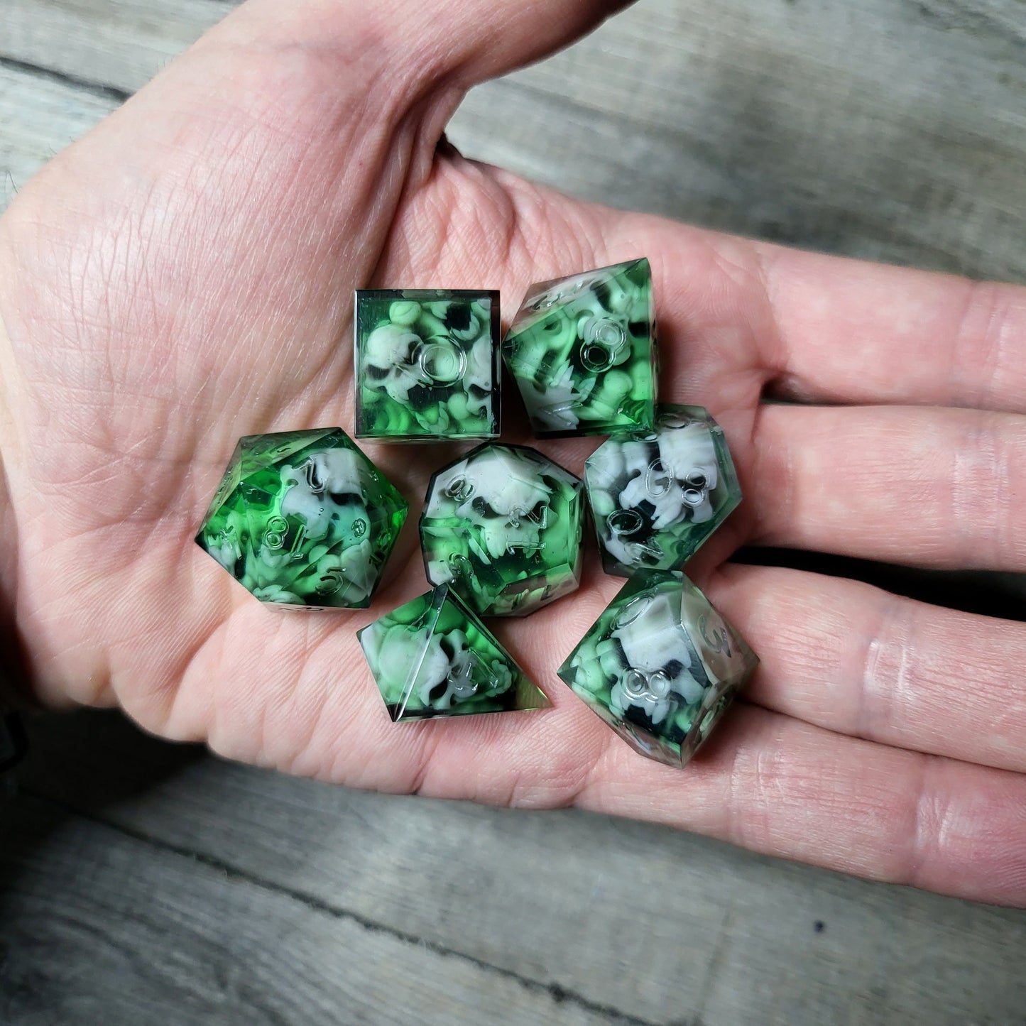 Dice set with 7 pieces with skull inside in spirit theme for role-playing games for Dungeons and Dragons