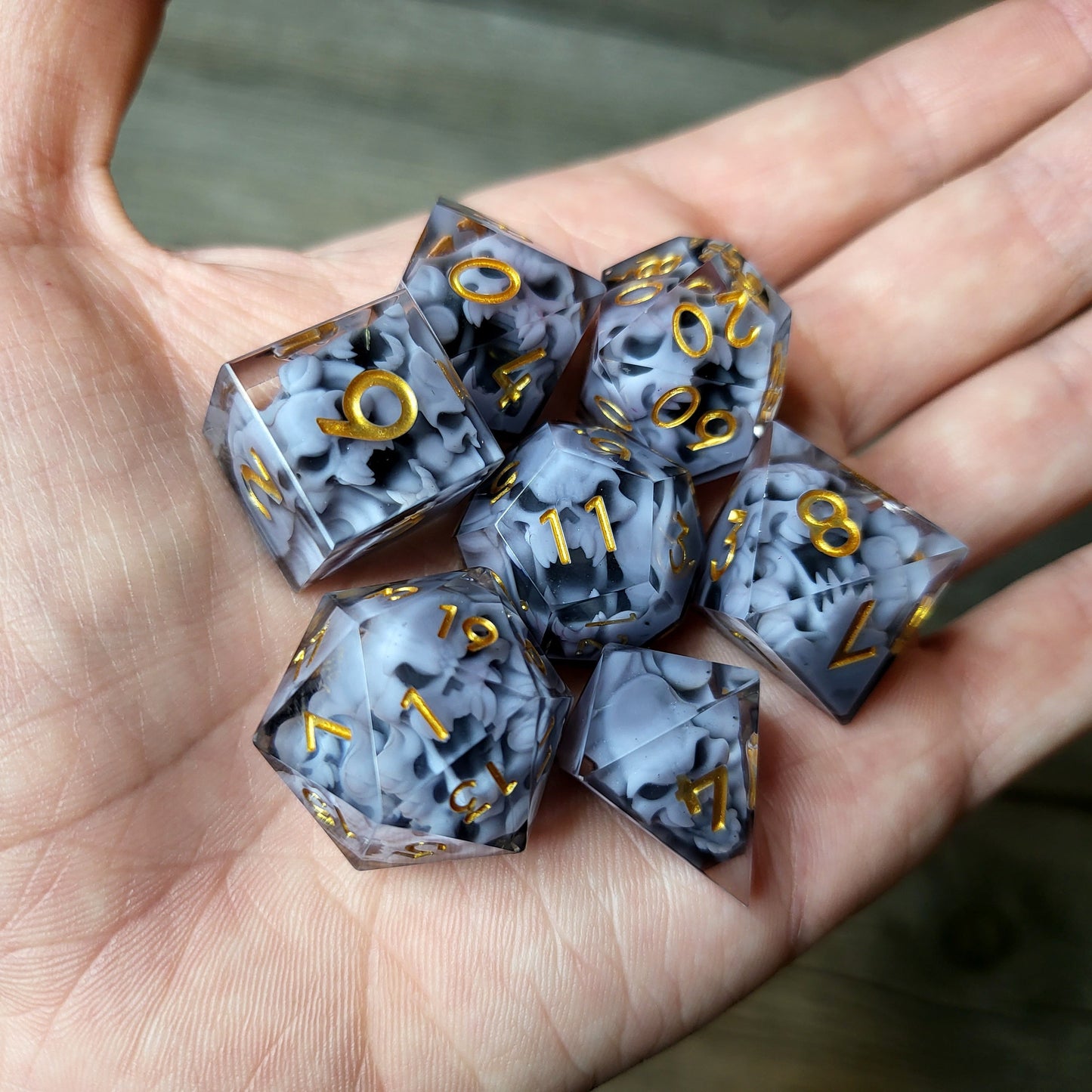 Dice set with 7 pieces with skull inside in spirit theme for role-playing games for Dungeons and Dragons