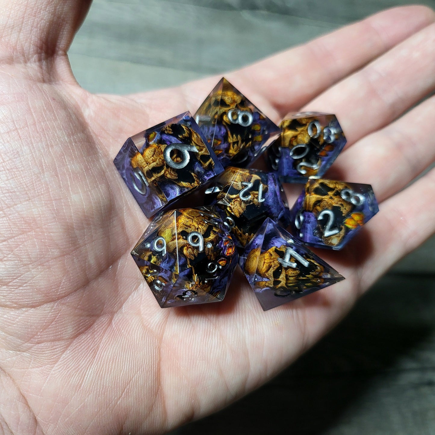 Dice set with 7 pieces with skull inside in spirit theme for role-playing games for Dungeons and Dragons