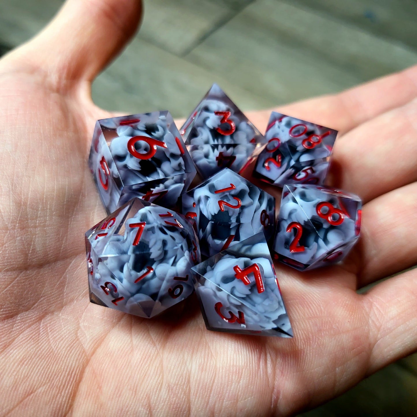 Dice set with 7 pieces with skull inside in spirit theme for role-playing games for Dungeons and Dragons