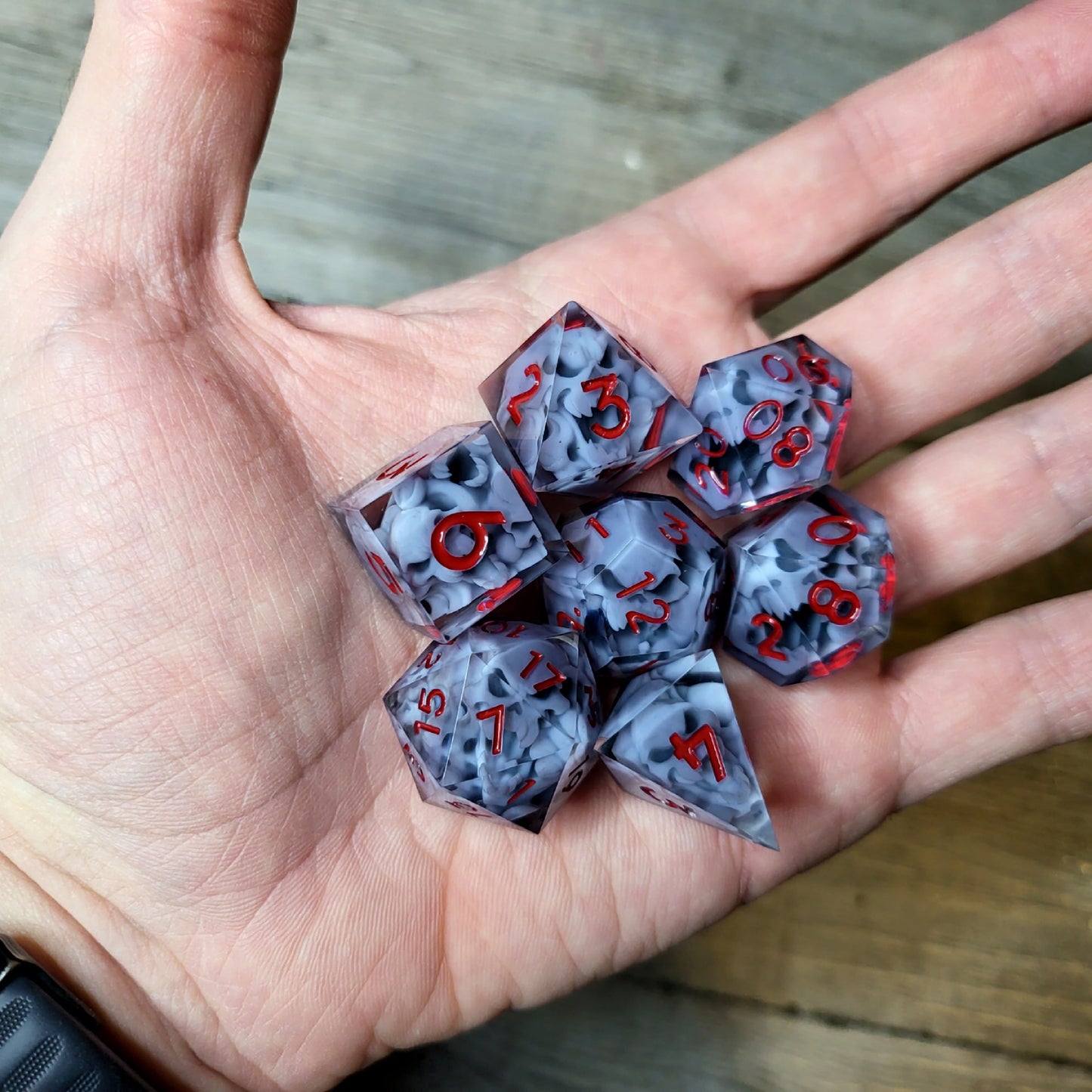 Dice set with 7 pieces with skull inside in spirit theme for role-playing games for Dungeons and Dragons