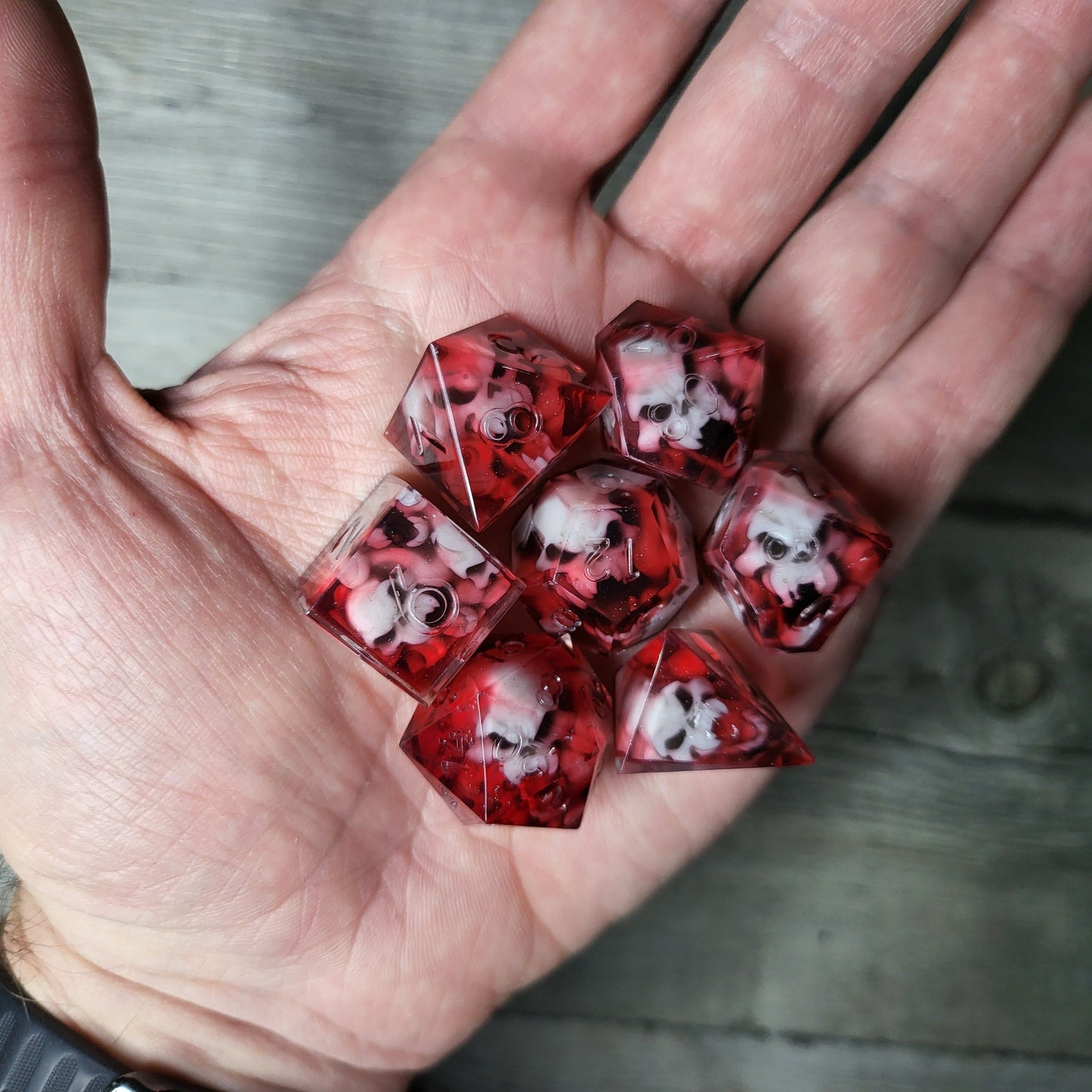 Dice set with 7 pieces with skull inside in spirit theme for role-playing games for Dungeons and Dragons