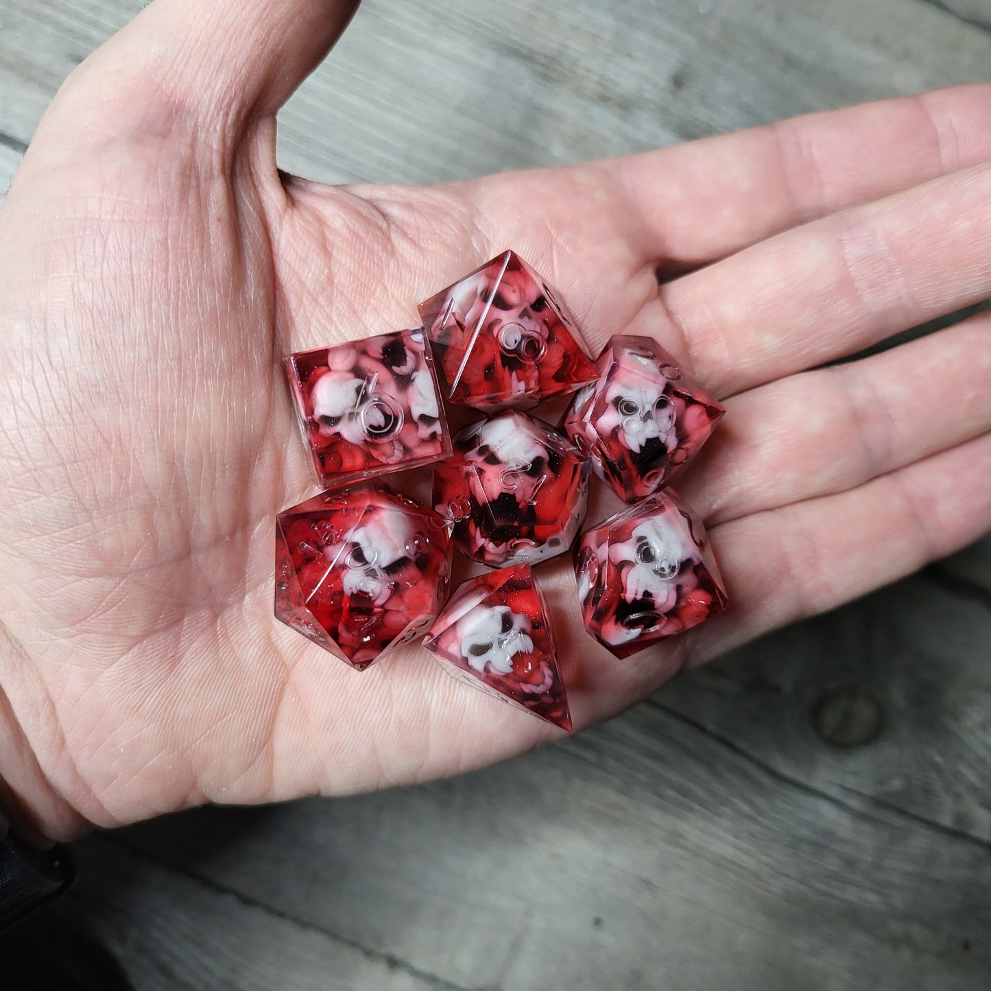 Dice set with 7 pieces with skull inside in spirit theme for role-playing games for Dungeons and Dragons