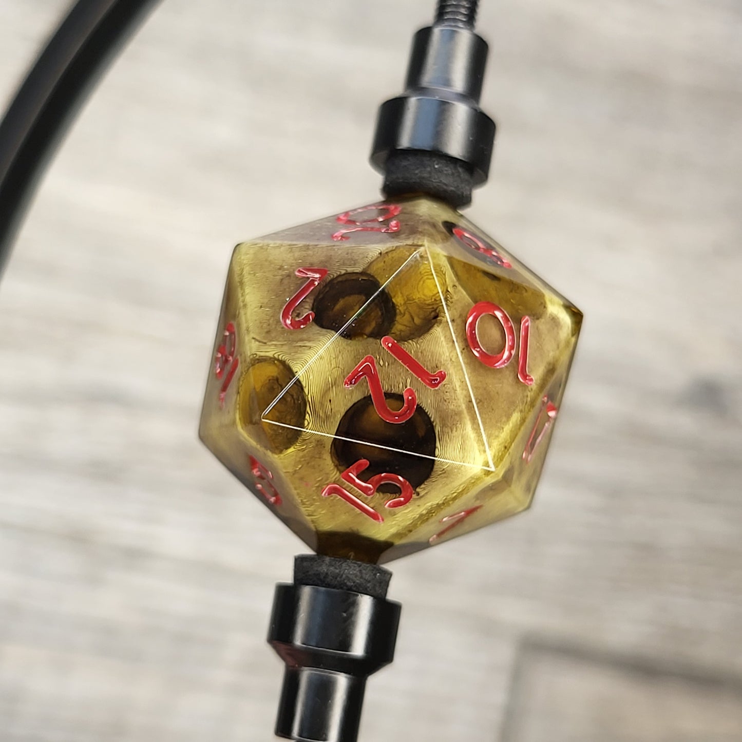 This is a single set of one D20 DnD dungeons and dragons die with a zombie cheese inside , red numbers