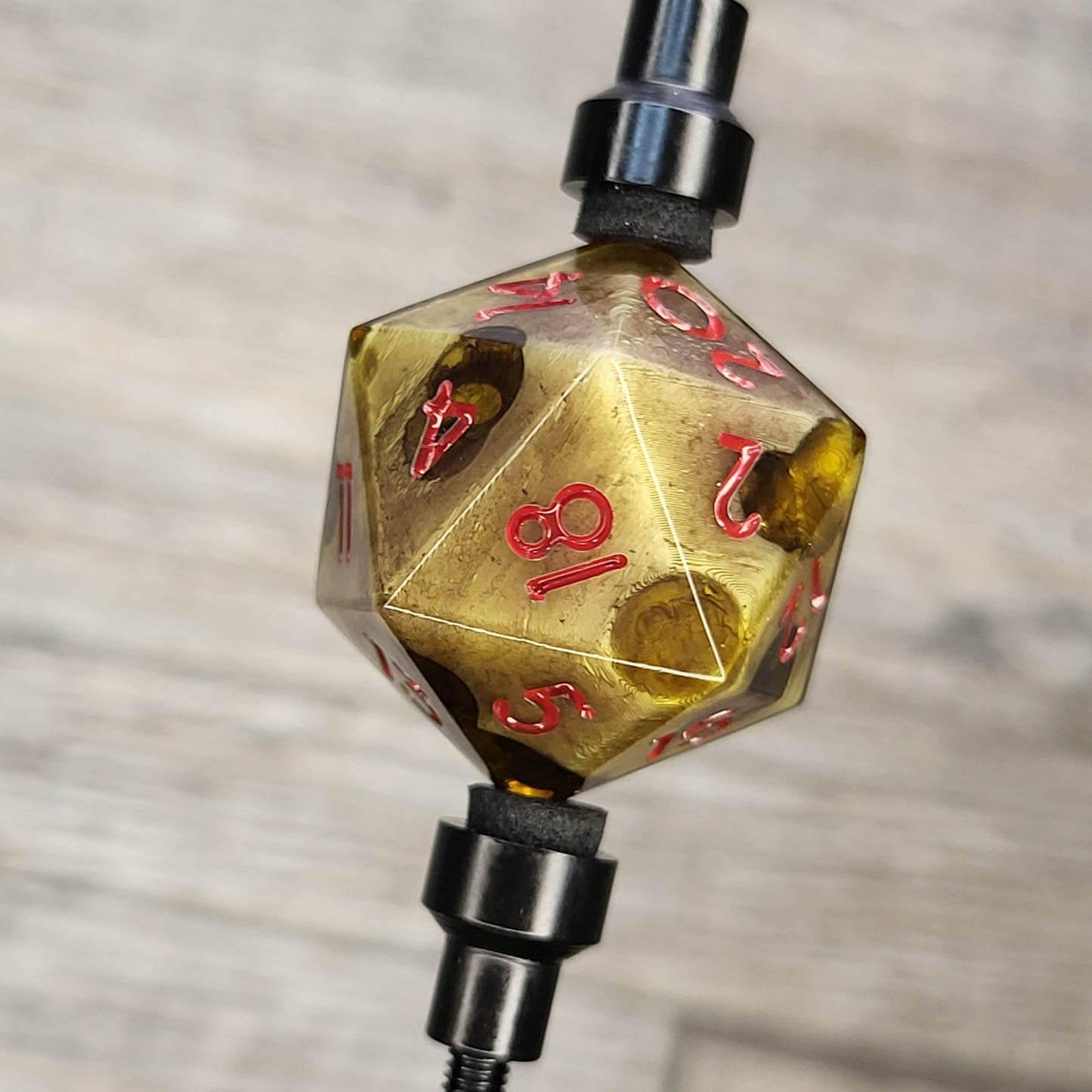 This is a single set of one D20 DnD dungeons and dragons die with a zombie cheese inside , red numbers