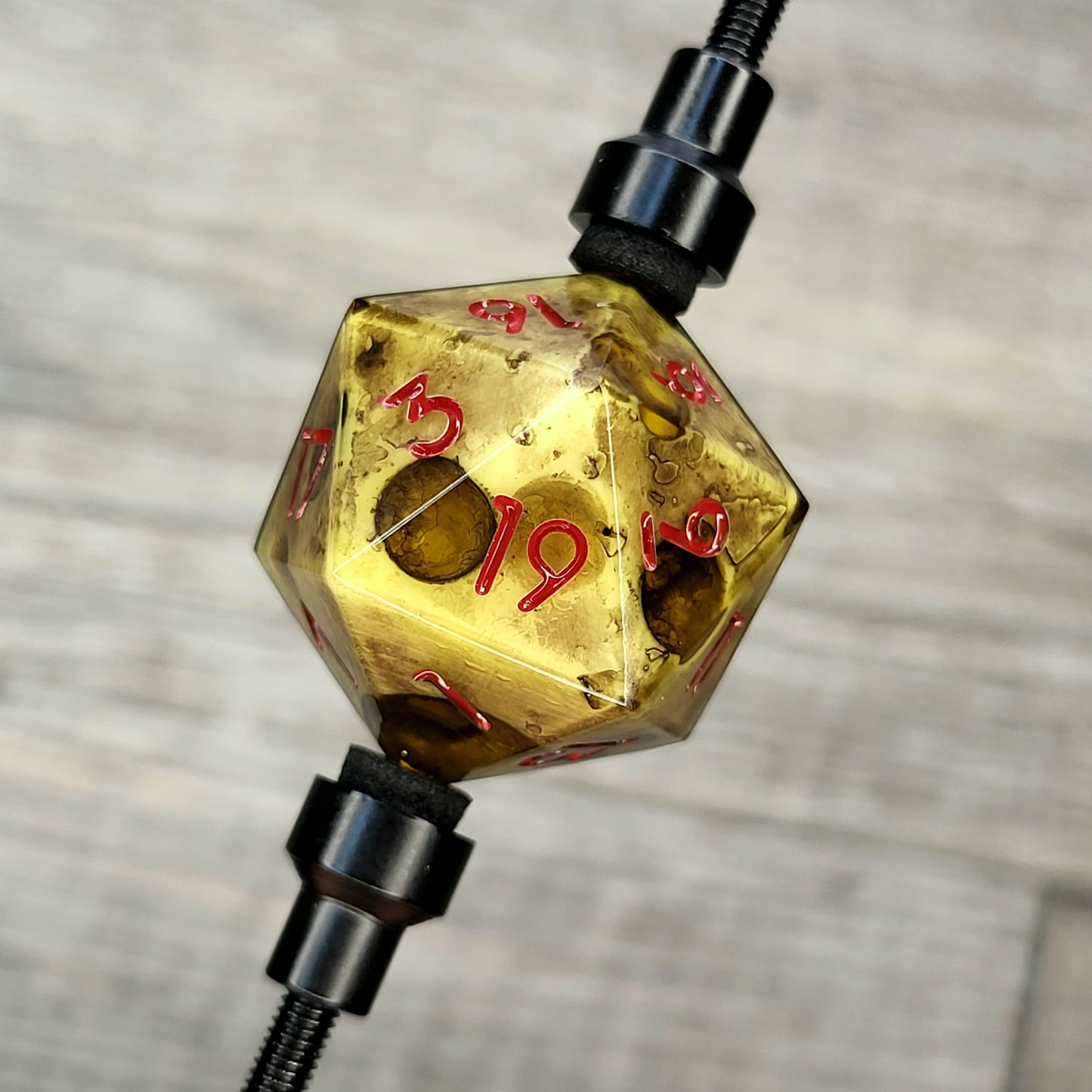 This is a single set of one D20 DnD dungeons and dragons die with a zombie cheese inside , red numbers