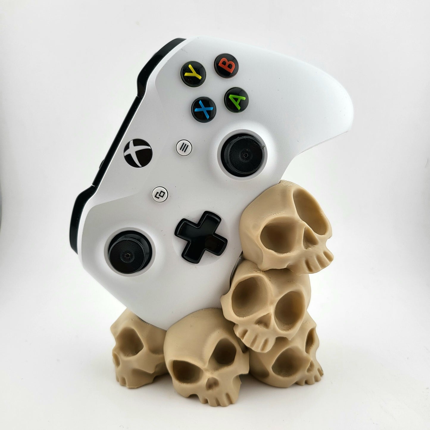 One xbox controller stand featuring a skull tower design , 3D printed with high-quality PLA.