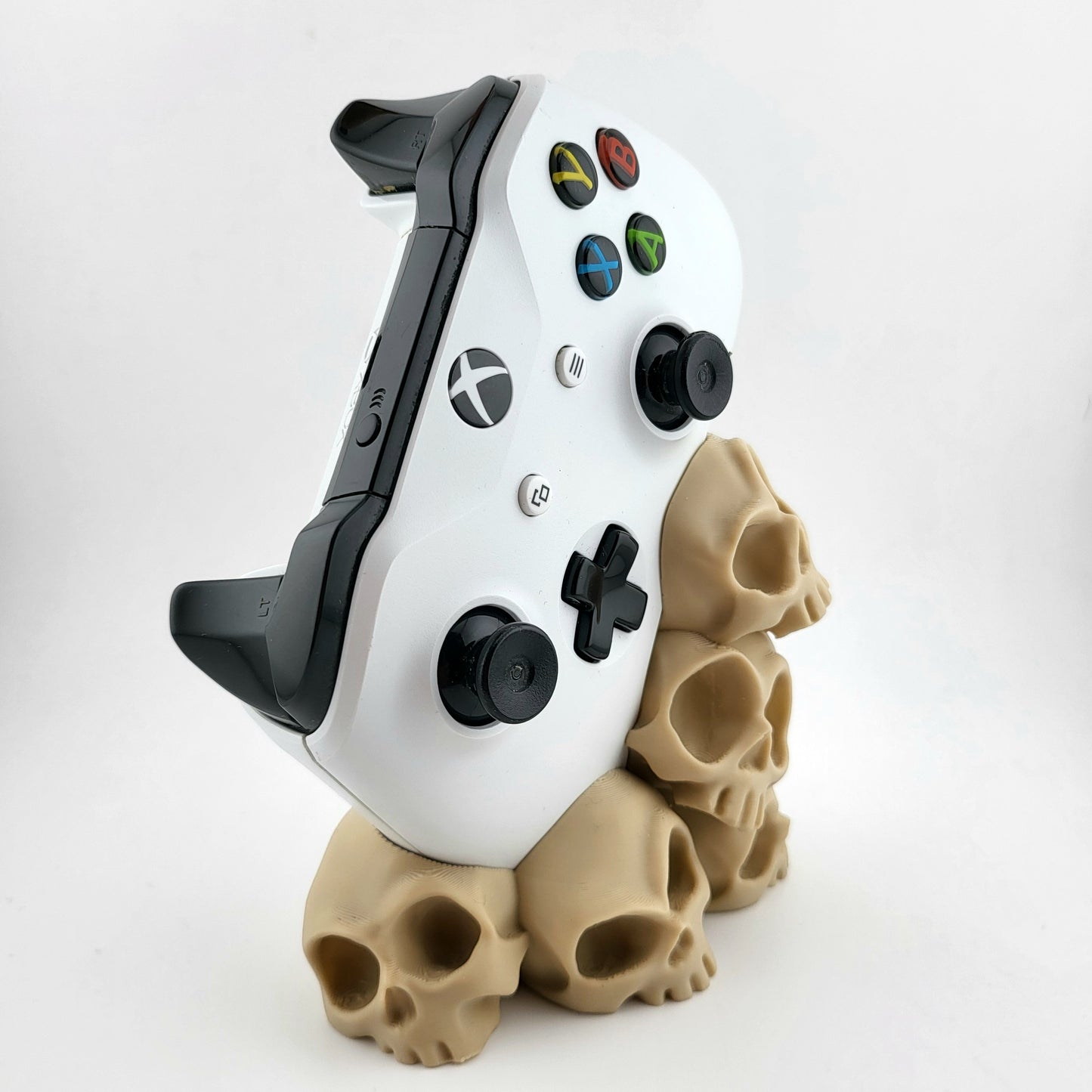 One xbox controller stand featuring a skull tower design , 3D printed with high-quality PLA.